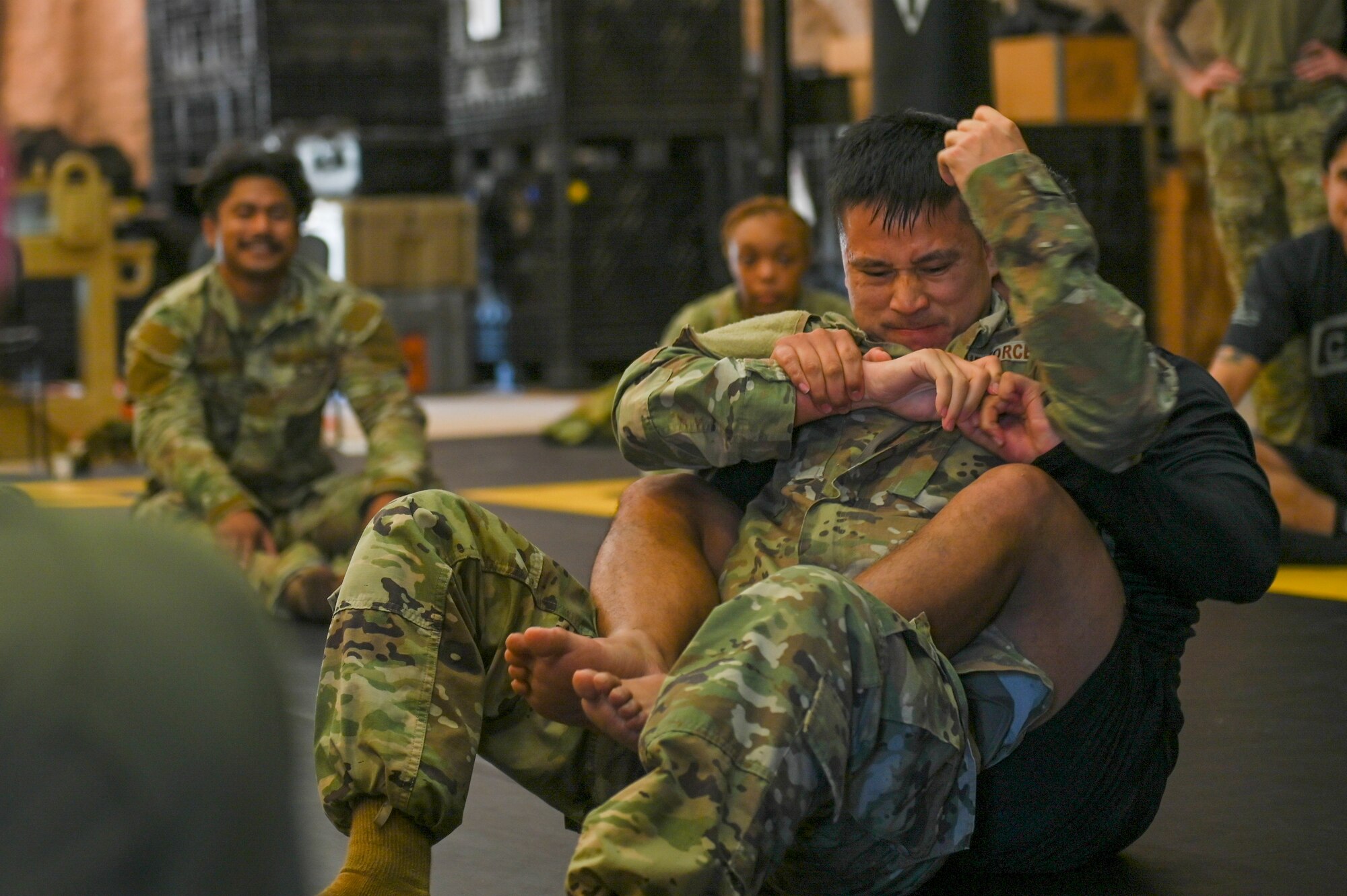 Airmen practicing combative skills