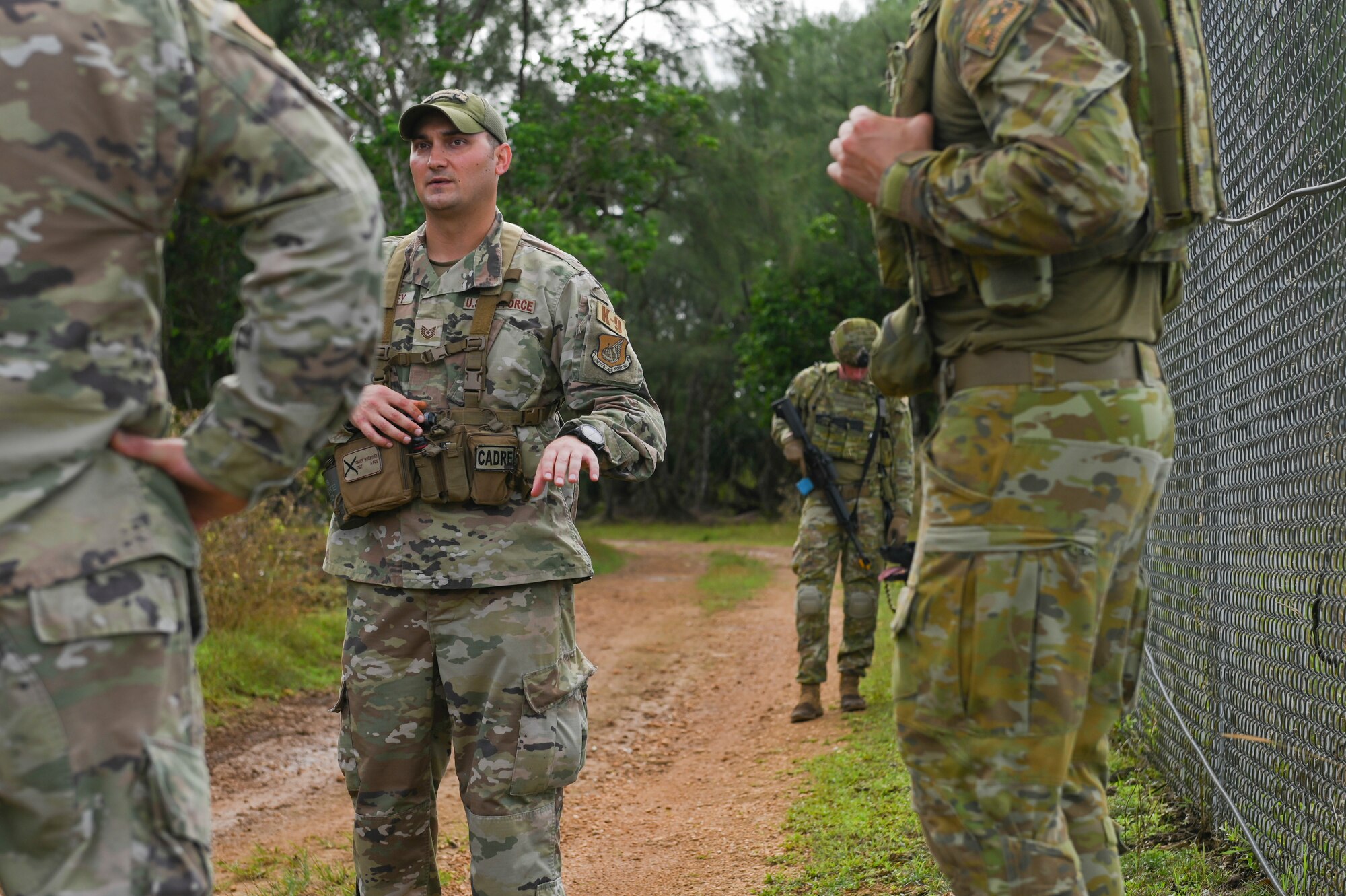 An Airmen briefing a group of people