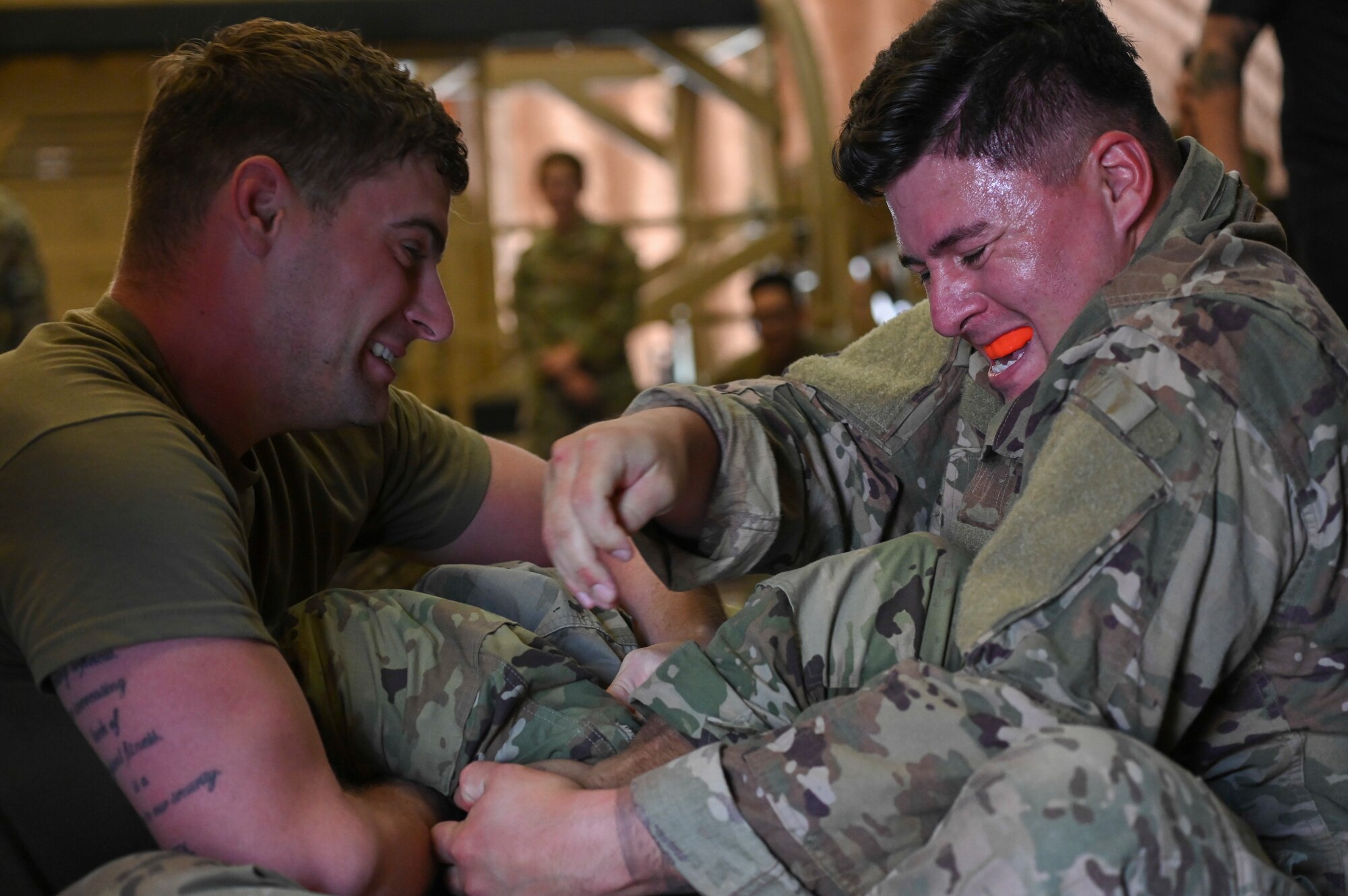 Australian and Airmen practicing combative skills
