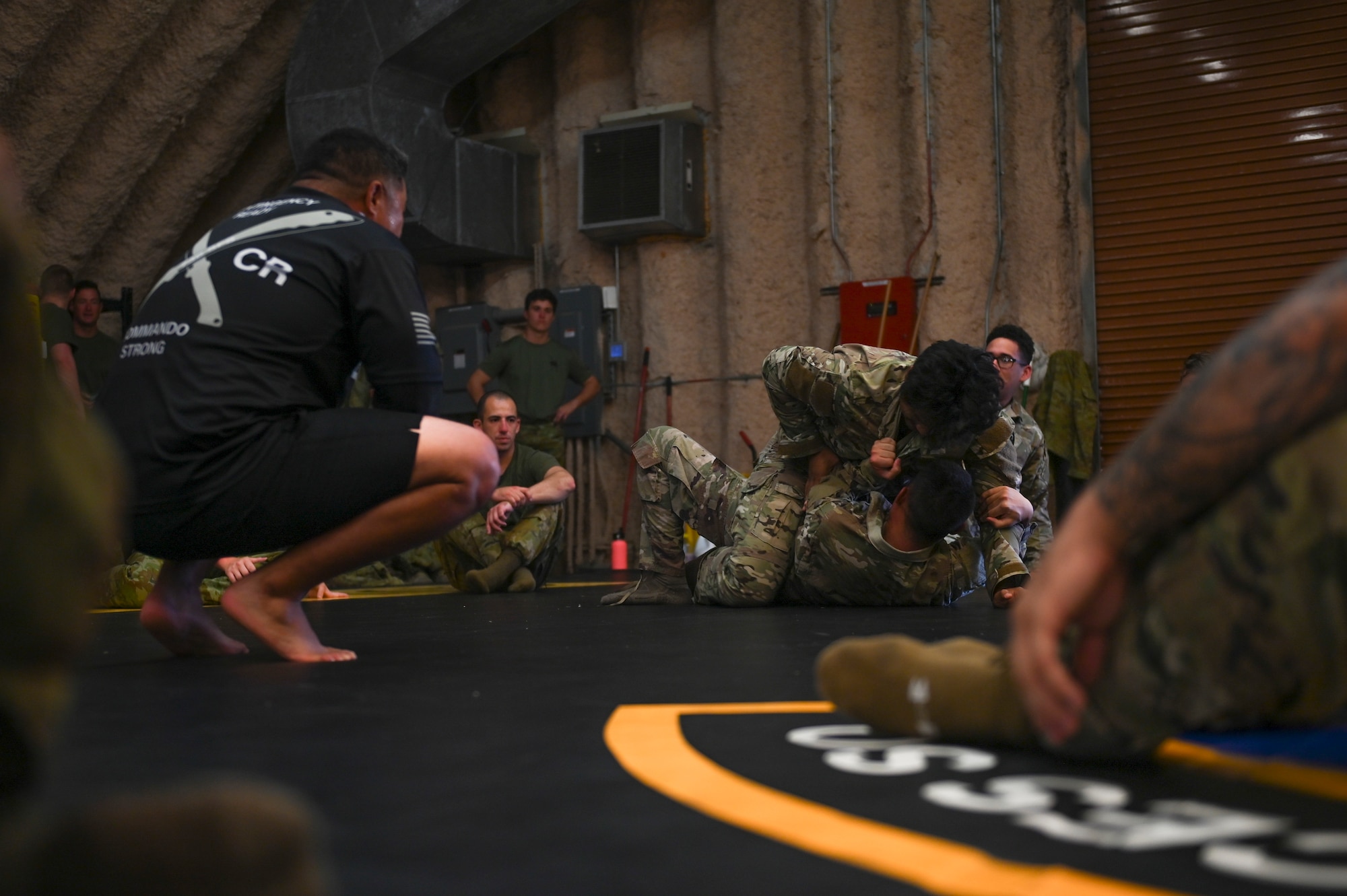 Airmen practicing combative skills