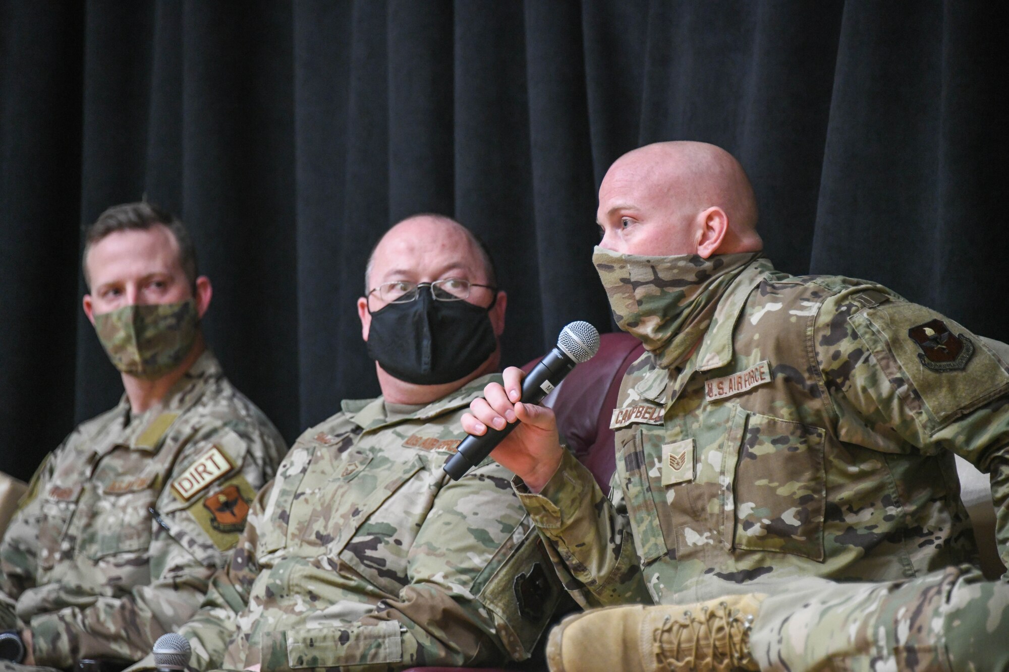 Airman talks on stage