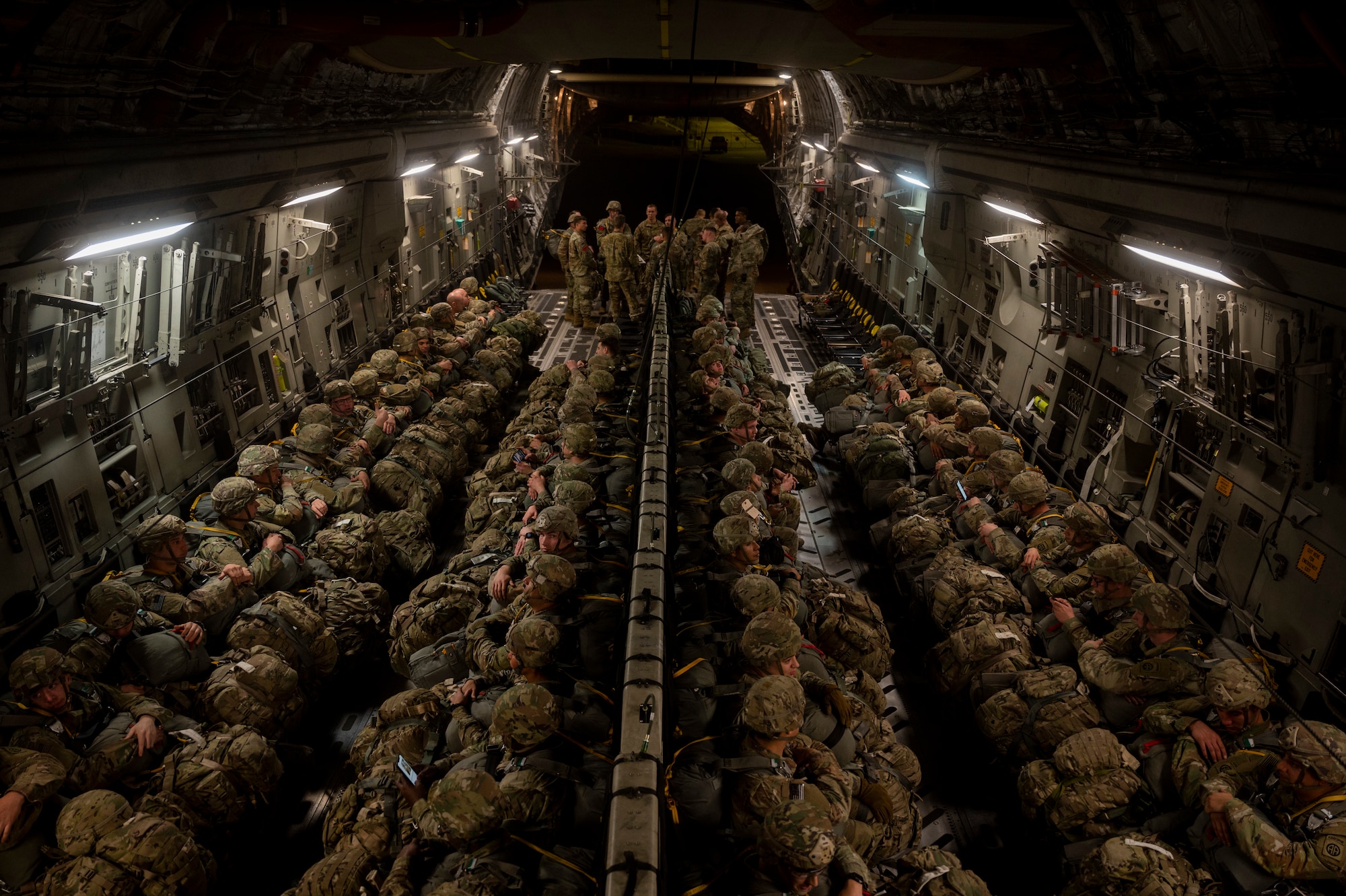 Soldiers inside a C-17 Globemaster III.