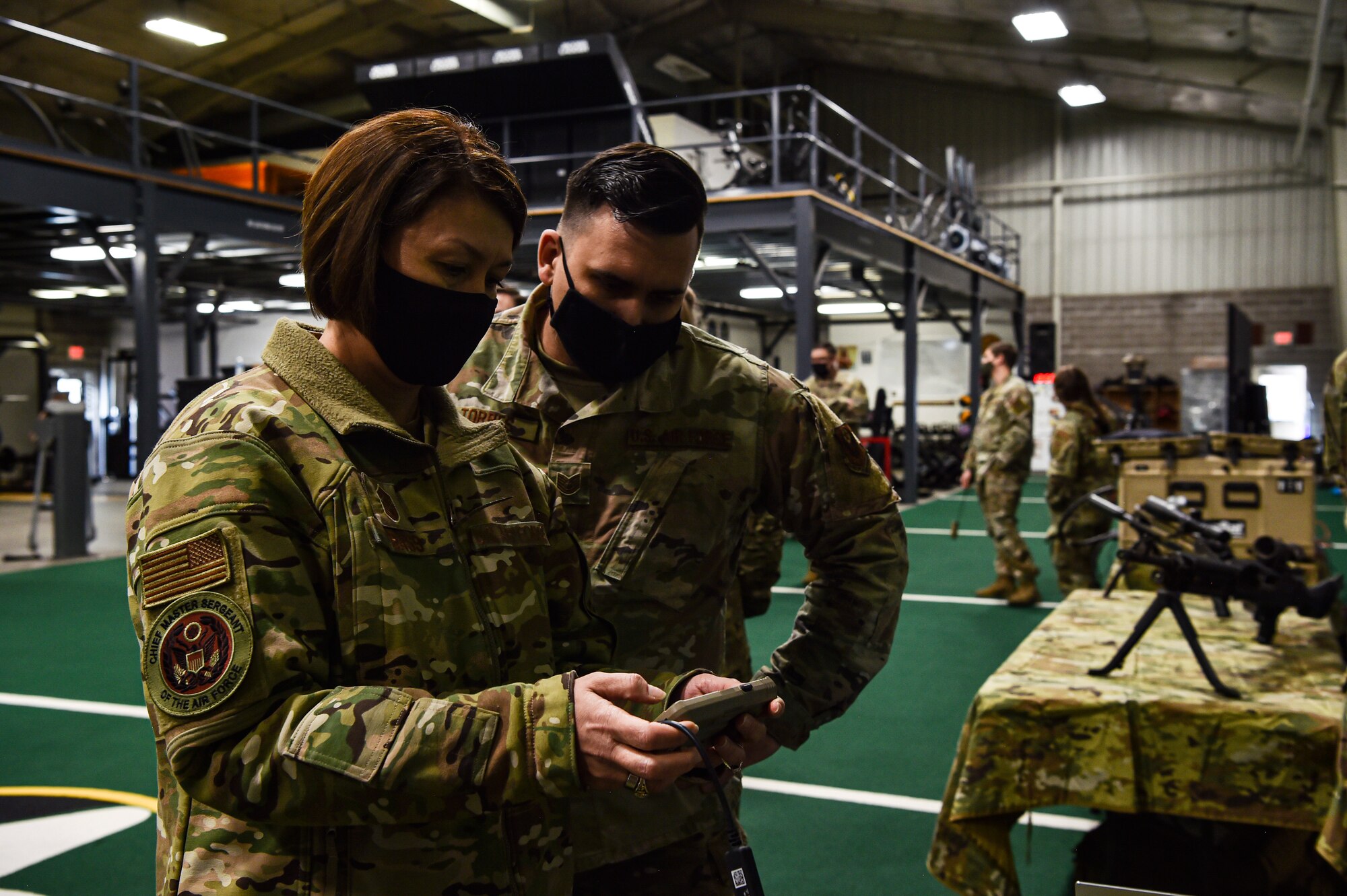 Chief Master Sergeant of the Air Force JoAnne S. Bass receives a tour of the Human Performance Facility from Tech. Sgt. Spencer Torres, 22nd Special Tactics Squadron radar airfield weather systems, during her visit to McChord Field at Joint Base Lewis-McChord, Washington, Feb. 1, 2022. Bass toured several McChord units and recognized Airmen for excellent performance. (U.S. Air Force photo by Staff Sgt. Tryphena Mayhugh)