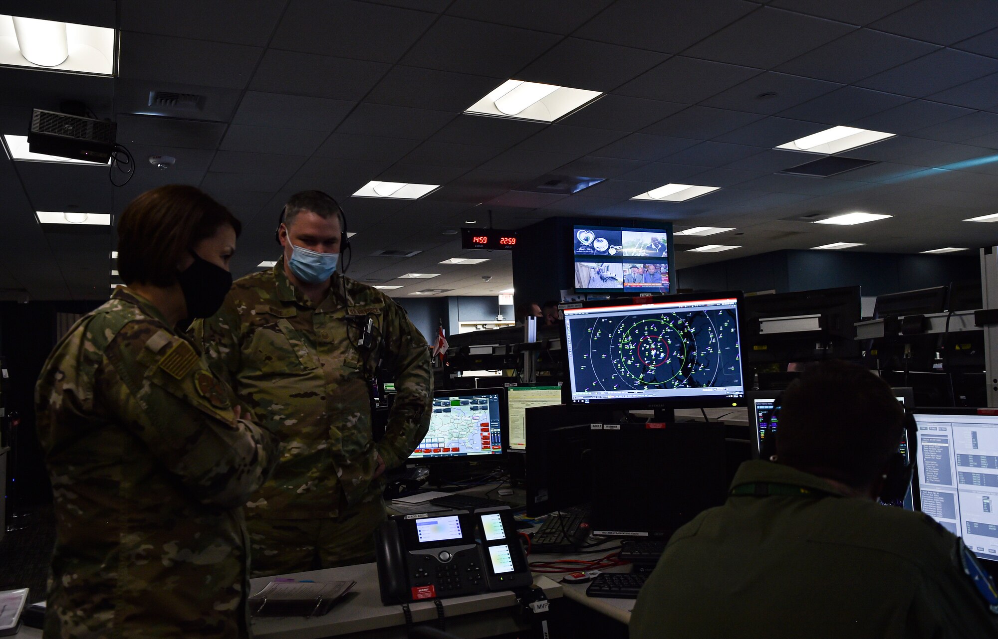 Chief Master Sergeant of the Air Force JoAnne S. Bass observes the Western Air Defense Sector operations during her visit to McChord Field at Joint Base Lewis-McChord, Washington, Feb. 1, 2022. Bass toured several McChord units and recognized Airmen for excellent performance. (U.S. Air Force photo by Staff Sgt. Tryphena Mayhugh)
