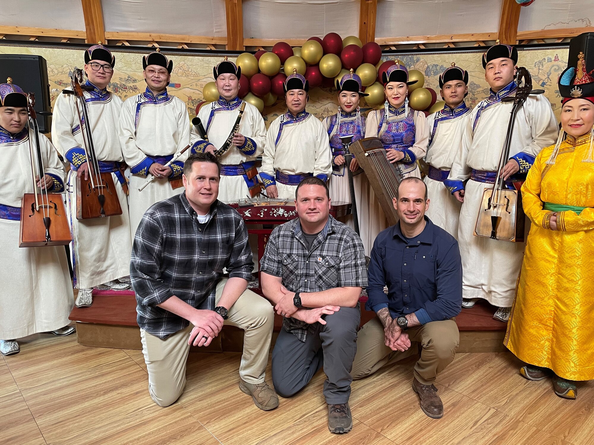 Alaska Air National Guard Chief Master Sgt. Mike Keegan, Lt. Col. Richard Welch, and Maj. Nathan Pooler pose for a photo with musical performers during the cultural day of the 2021 Airman to Airman Talks program in Mongolia Nov. 15-17. A2AT provides an avenue to develop interoperability, foster military-to-military relations and improve bilateral cooperation. The U.S. and partner nation air forces conduct these engagements to plan for upcoming bilateral activities and establish partner goals. This is the second time the Alaska National Guard participated in the A2AT program with Mongolia, hosted by U.S. Pacific Air Forces. (Courtesy photo)