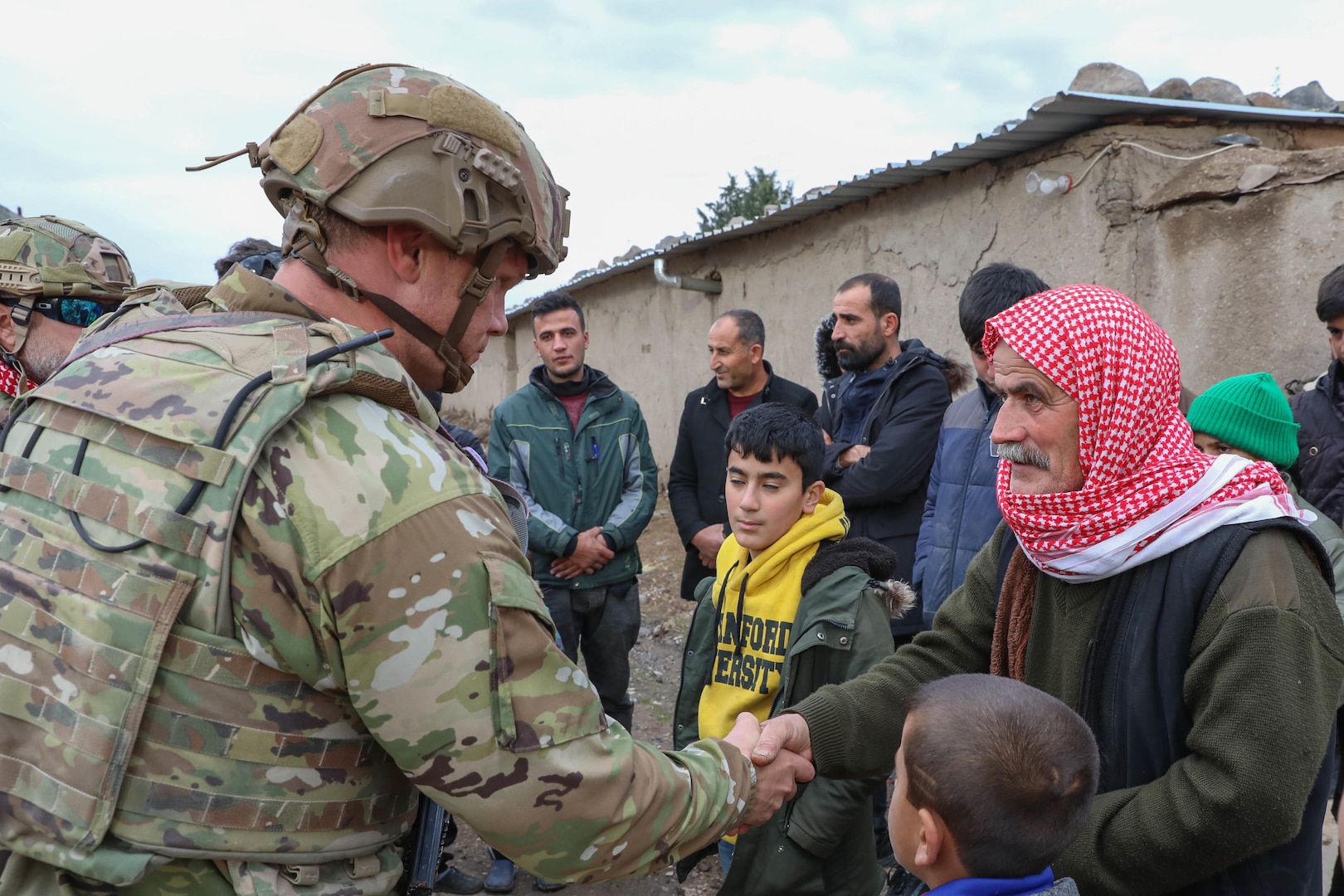 U.S. soldiers assigned to Comanche Troop 1st Brigade 4th Infantry Division conduct Key Leader Engagements (KLE) in Syria on December 23, 2021. KLE enable Coalition Joint Task Force Operation Inherent Resolve (CJTF - OIR) to collect information on local atmospherics and build positive sentiment toward USF and Coalition Forces. (U.S. Army photo by Spc. William Gore)