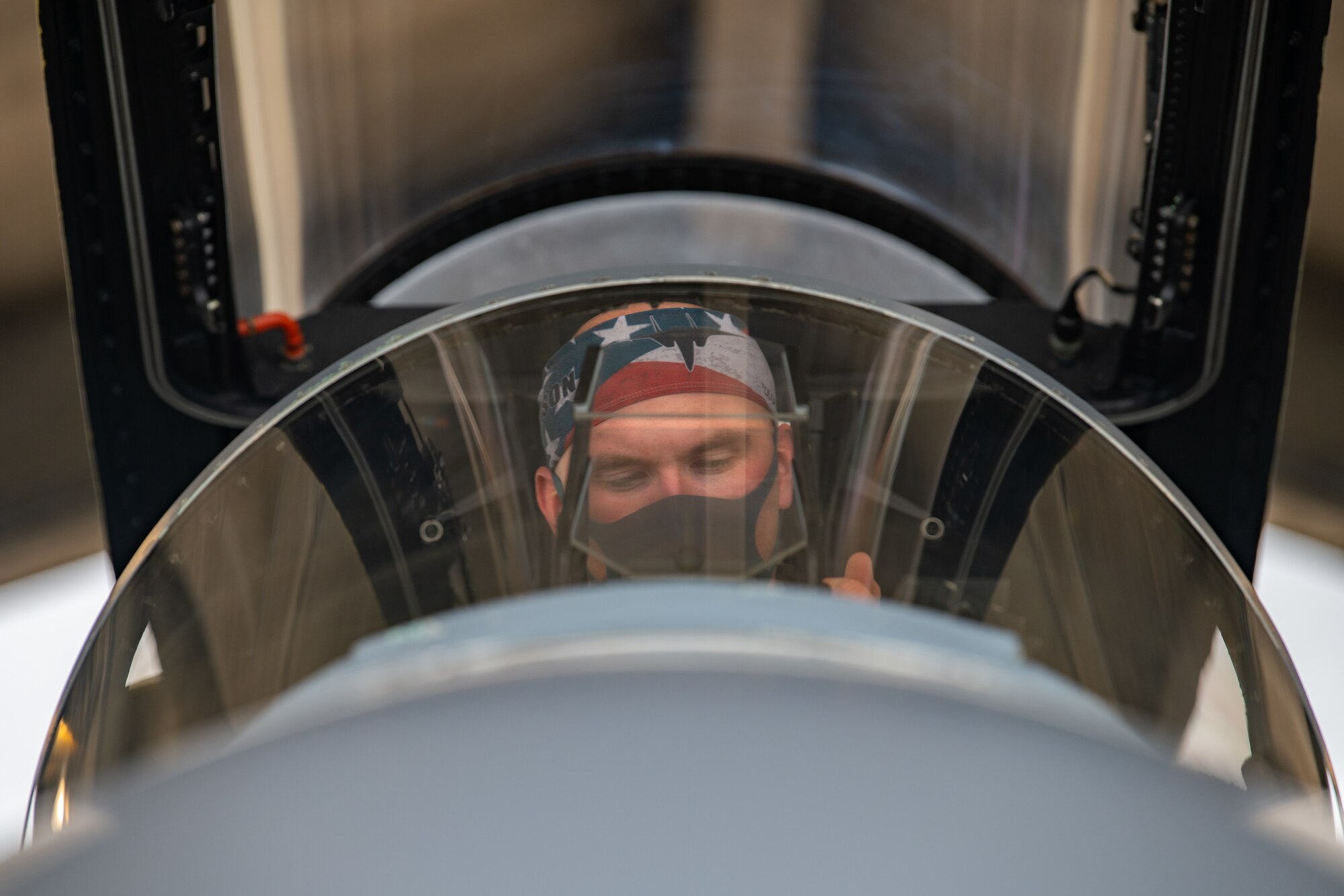 A pilot sits in his cockpit