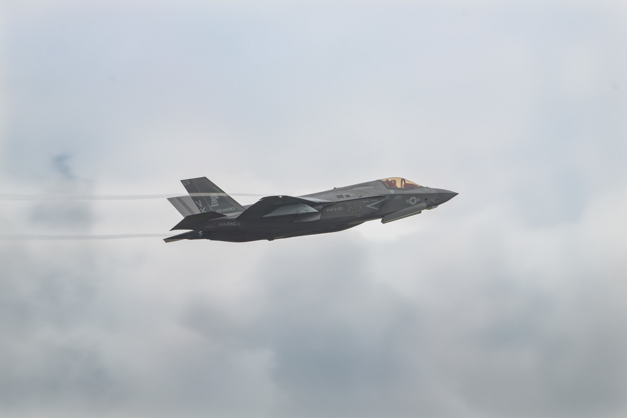 A fighter jet flies through the air
