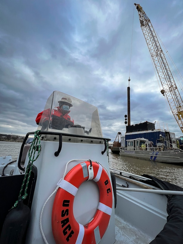 David Smith, U.S. Army Corps of Engineers, Baltimore District, crane operator, navigates past construction modifications of the District’s DC Drift field office docks alongside the Anacostia River on Jan 18, 2022. The docks will house the newly arriving NACOTCHTANK Floating Crane in the District of Columbia. The District’s DC Drift Program will continually protect environmental habitat, improve water quality and aesthetics, and expand public access within the Chesapeake Bay watershed. (U.S. Army photo by Greg Nash)