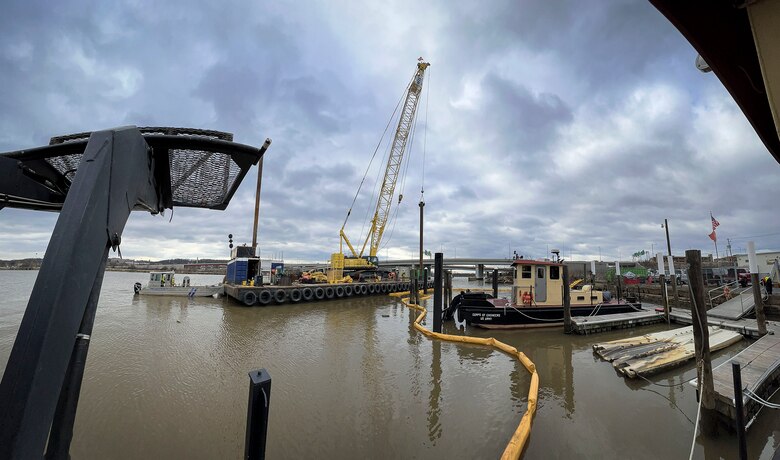 U.S. Army Corps of Engineers, Baltimore District’s DC Drift Program personnel oversee local contractors constructing a berthing slip for the NACOTCHTANK Floating Crane alongside the Anacostia River in the District of Columbia, Jan. 18, 2022. The program conducts drift removal operations year-round, which benefits navigation efforts by reducing damages, financial loss, and safety hazards to commercial and recreational vessels, operators, and docking facilities. (U.S. Army photo by Greg Nash)