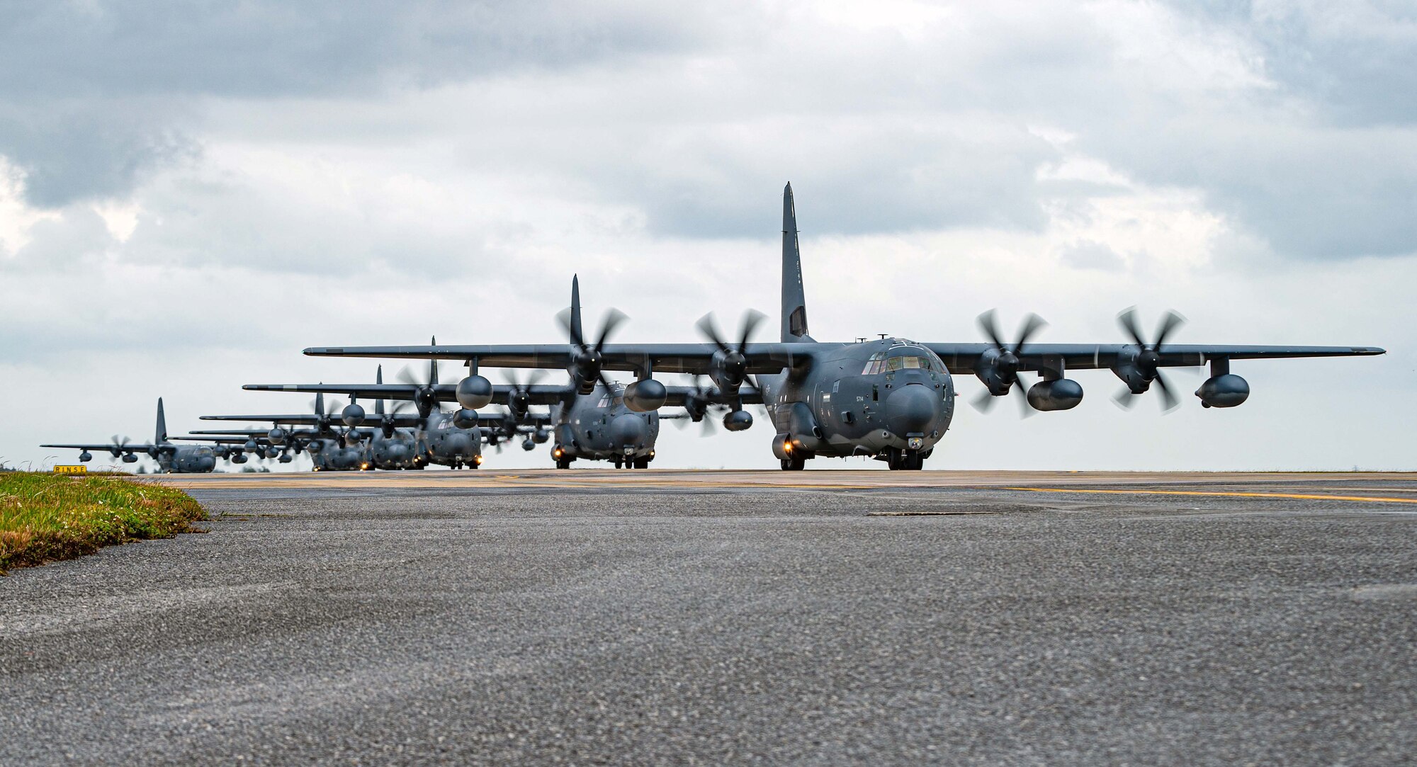 Six MC-130J Commando II aircraft assigned to the 1st Special Operations Squadron taxi down the flight line
