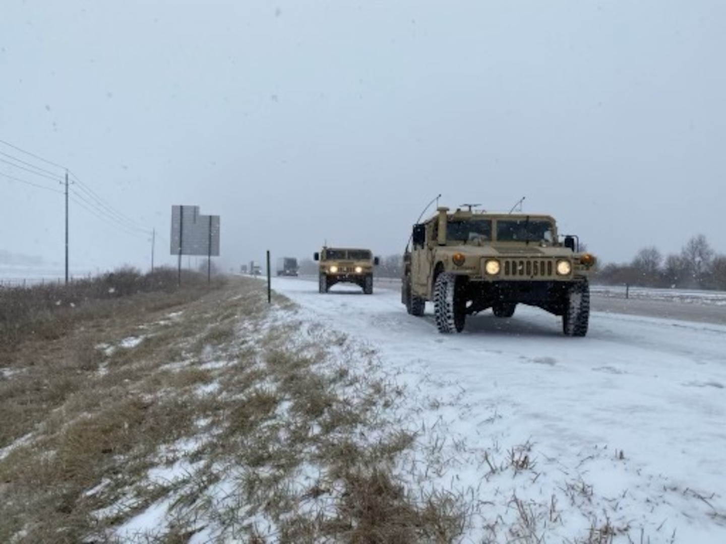 Indiana Guardsmen from the 38th Combat Aviation Brigade pull their Humvees over in order to assist drivers who slid off the road due to severe winter weather conditions, Thursday, Feb. 3, 2022. A total of 60 highway teams assisted along Hoosier highways with 20 in the northern part of the state, 20 in the central and 14 in the south, with an additional six ready to move to areas of the state with extreme weather impacts