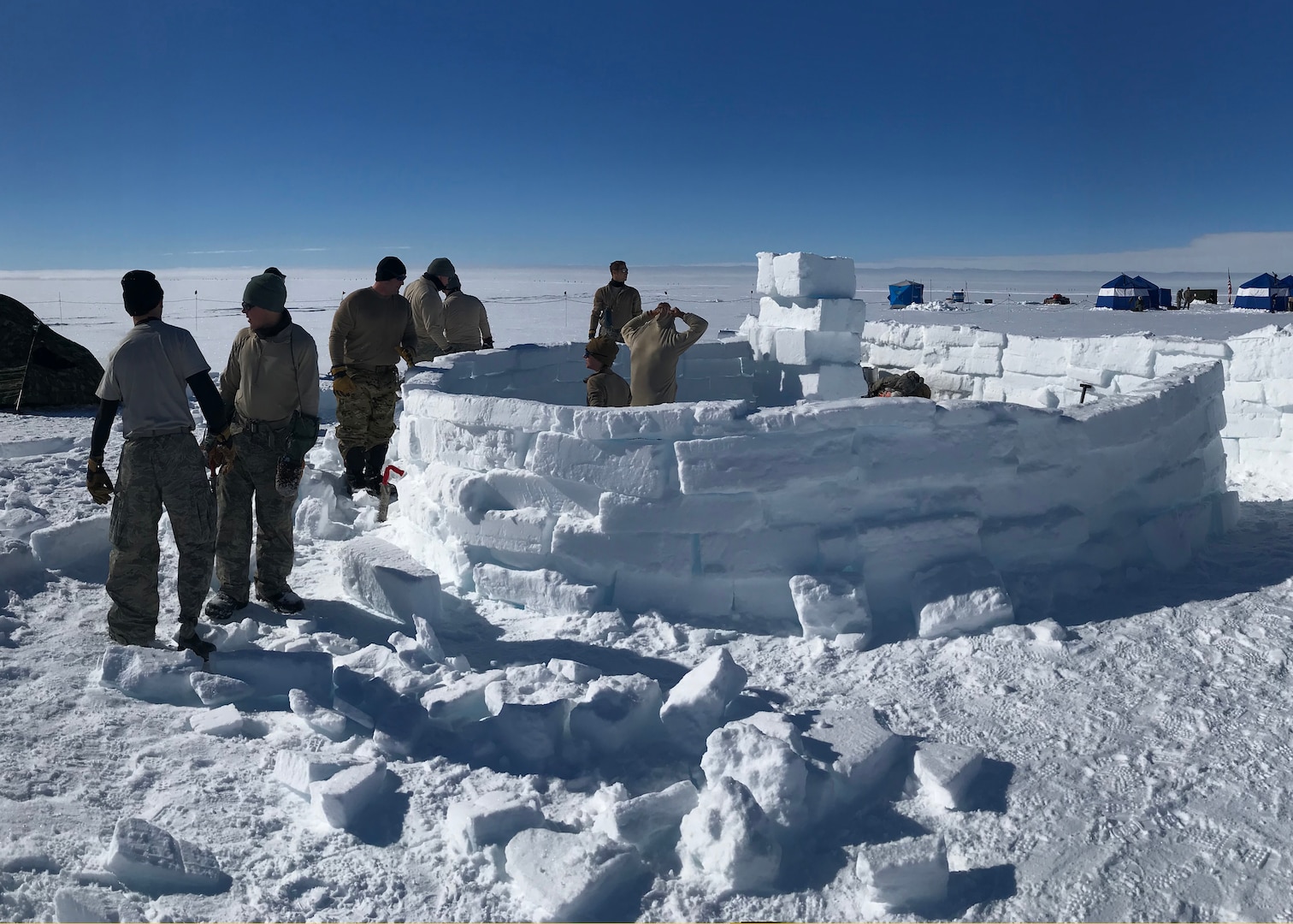 Airmen from the New York Air National Guard’s 109th Airlift Wing take part in Barren Land Arctic Survival Training at Raven Camp, Greenland. Students spend three days on the polar icecap learning to survive in barren arctic conditions.