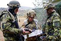 Spc. Keryx Quiban (center), a unit supply specialist with Headquarters and Headquarters Company, 2nd General Support Aviation Battalion, 1st Air Cavalry Brigade, 1st Cavalry Division, gets a pistol's serial number from Czech Republic airmen of the 22nd Helicopter Air Base during training at Hohenfels Training Area, Germany, Jan. 28, 2018. Soldiers from U.S. Army units are participating in Allied Spirit VIII, a multinational exercise with over 4,100 participants from 10 nations that is designed to enhance interoperability among participating militaries and improve the U.S. military's readiness.. (U.S. Army photo by Sgt. Gregory T. Summers / 22nd Mobile Public Affairs Detachment)