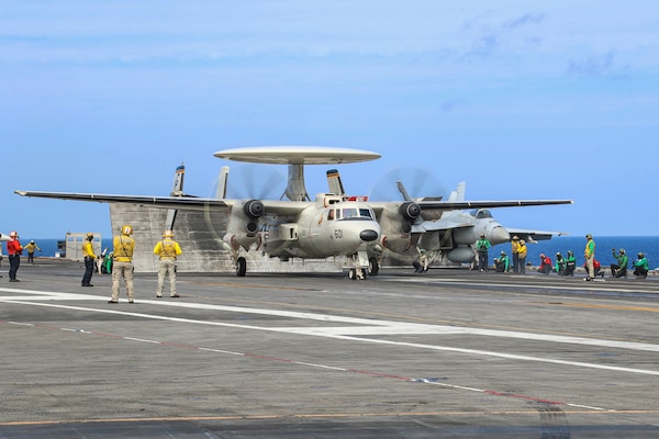 An E-2D Hawkeye prepares to launch from the flight deck of the Nimitz-class aircraft carrier USS Abraham Lincoln (CVN 72).