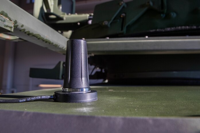 An antenna for data loggers affiliated with the Condition-Based Maintenance Plus (CBM+) program is mounted onto the top of a U.S. Marine Corps Medium Tactical Vehicle Replacement (MTVR) on Camp Lejeune, North Carolina, Feb. 1, 2022. CBM+ is a maintenance and supply strategy that integrates process improvement, failure data, and technology to influence maintenance actions, increase equipment availability, and improve fleet management. 2nd Transportation Battalion is the first unit in the Fleet Marine Force to install data loggers affiliated with CBM+. (U.S. Marine Corps photo by Lance Cpl. Jessica J. Mazzamuto)