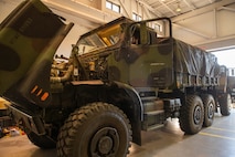 A U.S. Marine Corps Medium Tactical Vehicle Replacement (MTVR) prepares to receive a data logger affiliated with the Condition Based Maintenance Plus (CBM+) program at 2nd Transportation Battalion, Combat Logistics Regiment 27, on Camp Lejeune, North Carolina, Feb. 1, 2022. CBM+ is a maintenance and supply strategy that integrates process improvement, failure data, and technology to influence maintenance actions, increase equipment availability, and improve fleet management. 2nd Transportation Battalion is the first unit in the Fleet Marine Force to install data loggers affiliated with CBM+. (U.S. Marine Corps photo by Lance Cpl. Jessica J. Mazzamuto)