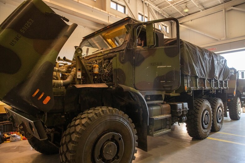 A U.S. Marine Corps Medium Tactical Vehicle Replacement (MTVR) prepares to receive a data logger affiliated with the Condition Based Maintenance Plus (CBM+) program at 2nd Transportation Battalion, Combat Logistics Regiment 27, on Camp Lejeune, North Carolina, Feb. 1, 2022. CBM+ is a maintenance and supply strategy that integrates process improvement, failure data, and technology to influence maintenance actions, increase equipment availability, and improve fleet management. 2nd Transportation Battalion is the first unit in the Fleet Marine Force to install data loggers affiliated with CBM+. (U.S. Marine Corps photo by Lance Cpl. Jessica J. Mazzamuto)