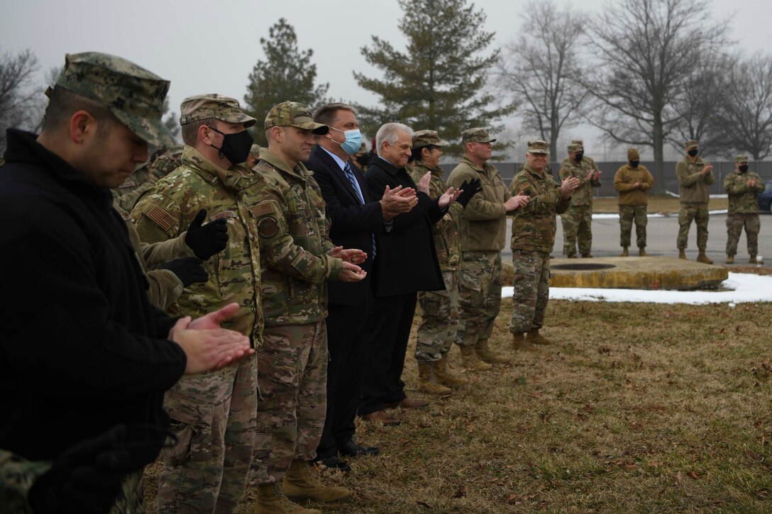 Guests clap to congratulate honorees breaking ground for the new Consolidated Communications Center at Joint Base Andrews, Md., Feb. 2, 2022. The project is a joint effort between the Air Force District of Washington, the 316th Wing, the Air Force Civil Engineer Center at Joint Base San Antonio-Lackland, Texas, the Naval Facilities Engineering Systems Command of Washington D.C. and the London-based infrastructure group Balfour Beatty. (U.S. Air Force photo by Senior Airman Spencer Slocum)