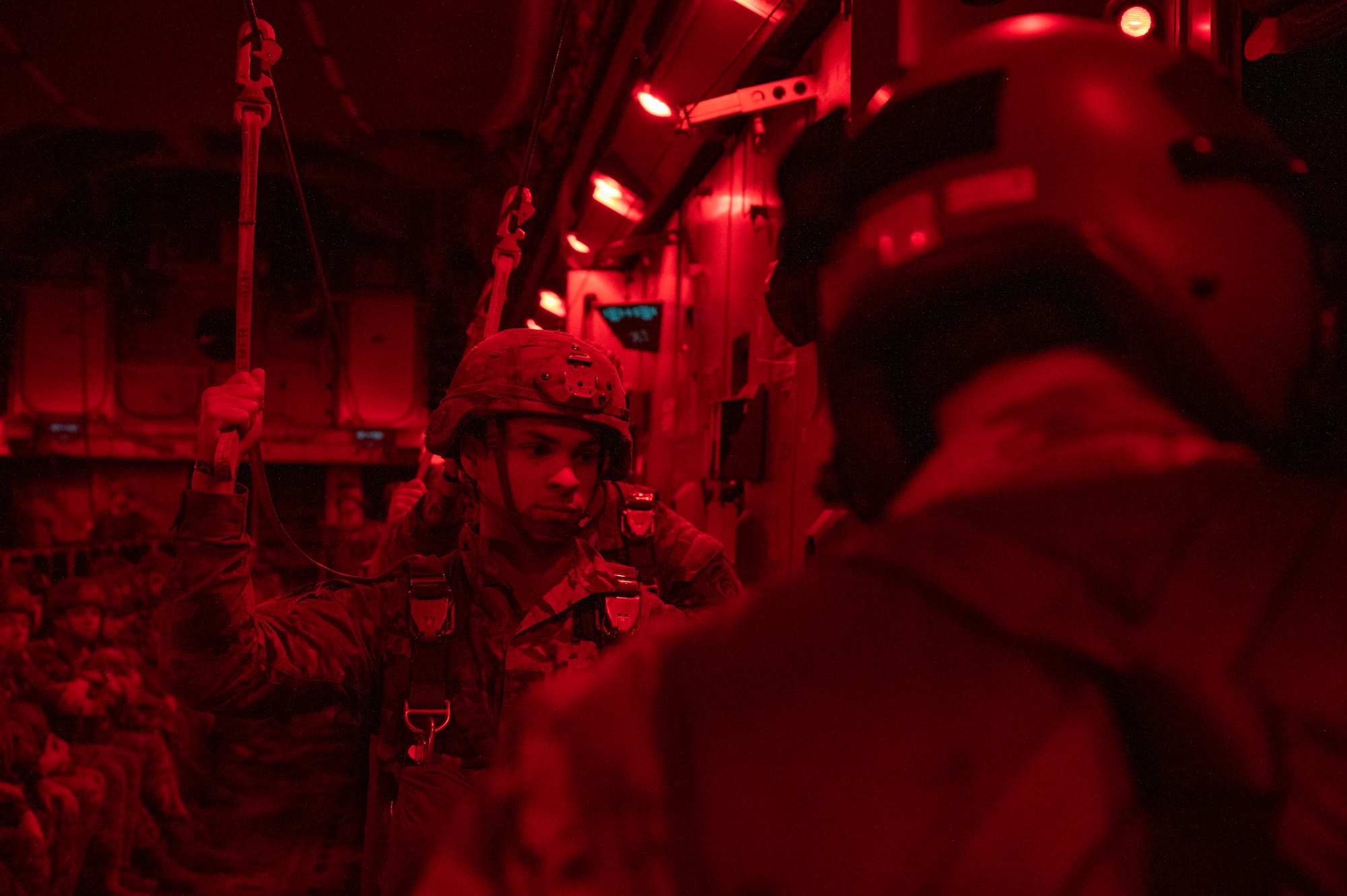 U.S. Army Soldiers assigned to the 82nd Airborne Division, Fort Bragg, North Carolina, prepare to exit a C-17 Globemaster III during Battalion Mass Tactical Week at Pope Army Airfield, North Carolina, Feb. 3, 2022. BMTW is a joint exercise between the U.S. Air Force and      U.S. Army, which gives participants the ability to practice contingency operations in a controlled environment. (U.S. Air Force photo by Airman 1st Class Charles Casner)