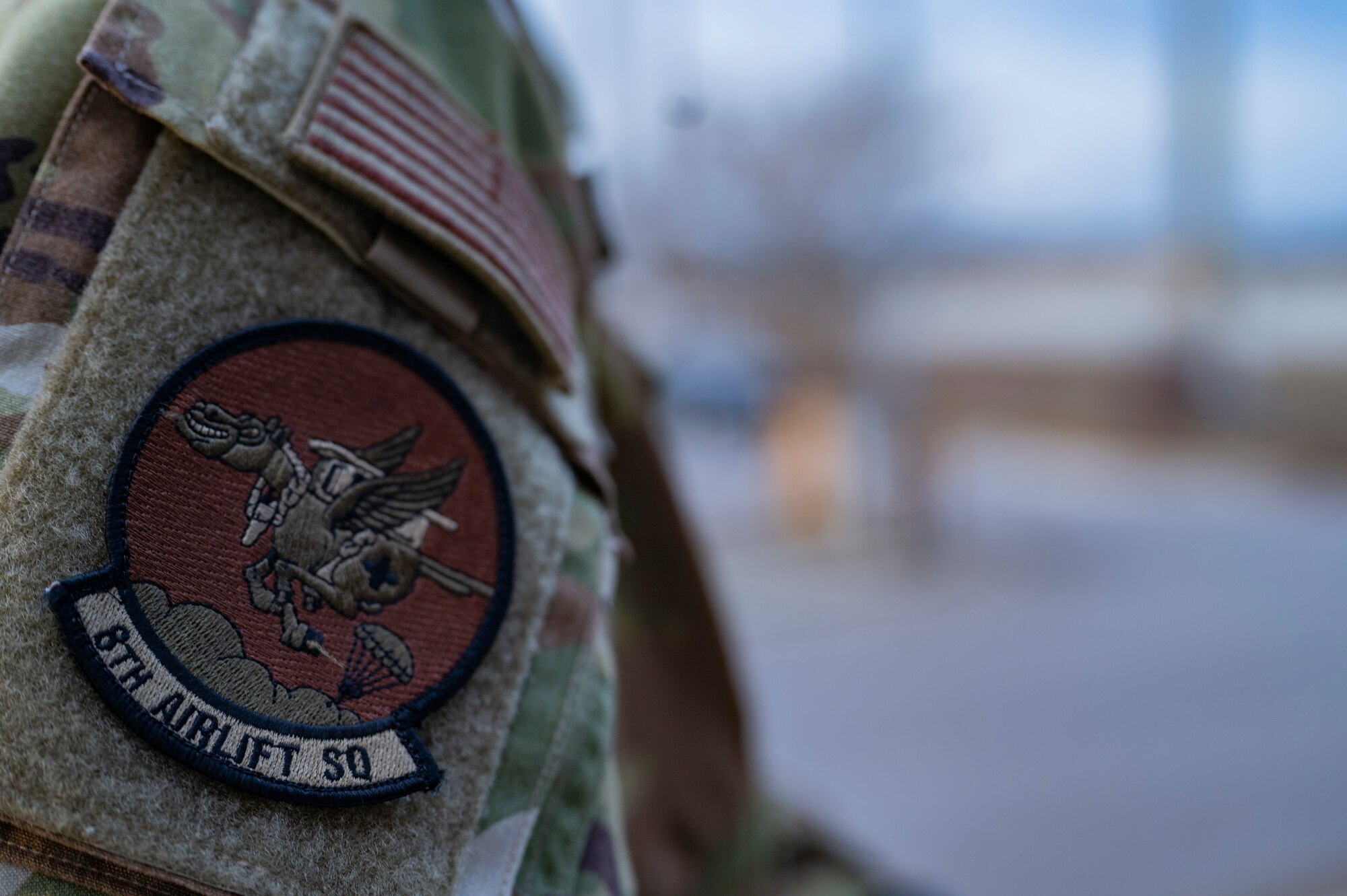 U.S. Air Force Senior Airman Michael MacDougall, a loadmaster with the 8th Airlift Squadron, prepares to walk out to the flightline during Battalion Mass Tactical Week at Pope Army Airfield, North Carolina, Feb. 3, 2022.  BMTW is a joint exercise between the U.S. Air Force and U.S. Army to enhance members’ abilities by practicing scenarios in a controlled environment. (U.S. Air Force photo by Airman 1st Class Charles Casner)