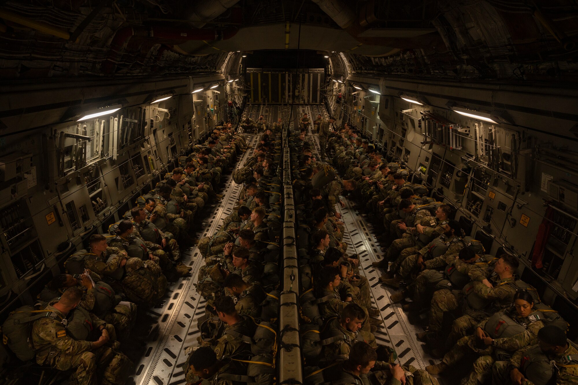 U.S. Army paratroopers assigned to the 82nd Airborne Division, Fort Bragg, North Carolina, prepare for takeoff on a C-17 Globemaster III during Battalion Mass Tactical Week, or BMTW, at Pope Army Airfield, North Carolina, Feb. 3, 2022. BMTW is a joint exercise between the U.S. Air Force and      U.S. Army, which gives participants the ability to practice contingency operations in a controlled environment. (U.S. Air Force photo by Airman 1st Class Charles Casner)