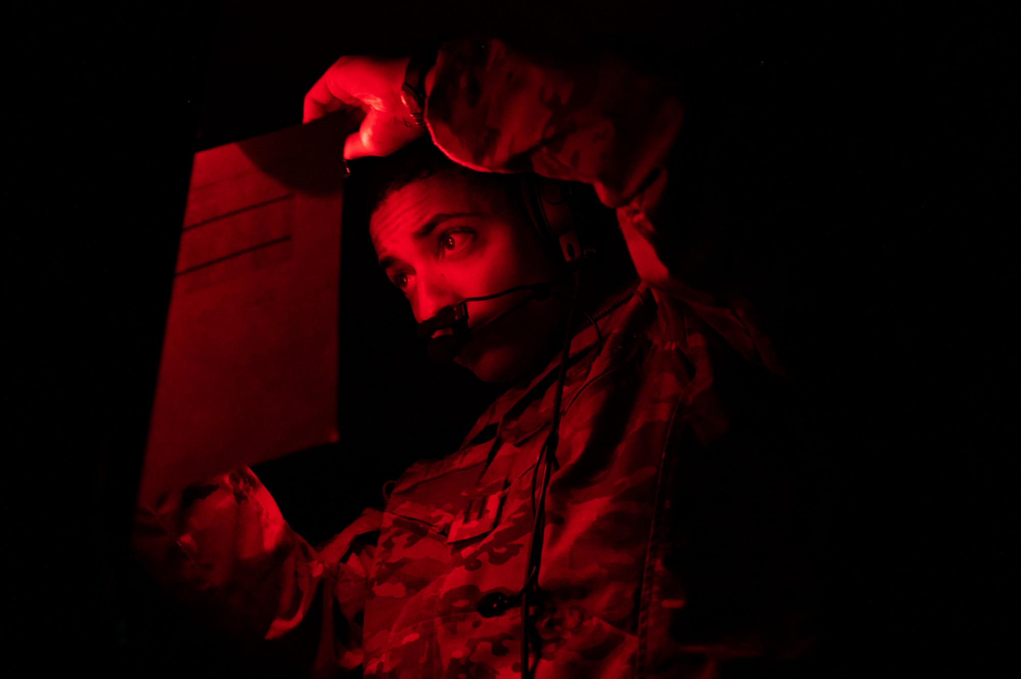 U.S. Air Force Capt. Brandon Vasey, 16th Airlift Squadron pilot, plots simulated threats during Battalion Mass Tactical Week at Pope Army Airfield, North Carolina, Feb. 3, 2022. During mass-tactical week, Army and Air Force units work together to improve interoperability for worldwide crisis, contingency and humanitarian operations. (U.S. Air Force photo by Airman 1st Class Charles Casner)