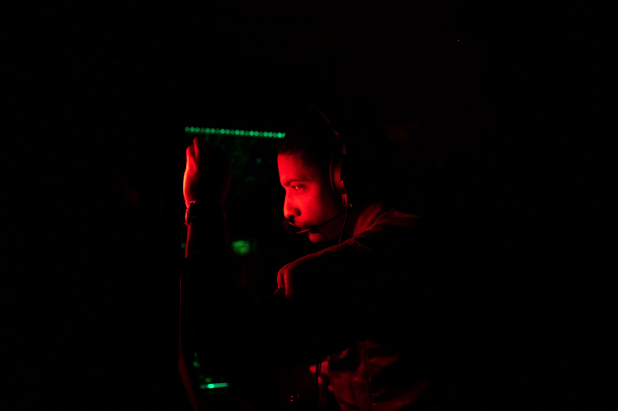 U.S. Air Force Capt. Brandon Vasey, 16th Airlift Squadron pilot, plots simulated threats during Battalion Mass Tactical Week at Pope Army Airfield, North Carolina, Feb. 3, 2022. During mass-tactical week, Army and Air Force units work together to improve interoperability for worldwide crisis, contingency and humanitarian operations. (U.S. Air Force photo by Airman 1st Class Charles Casner)