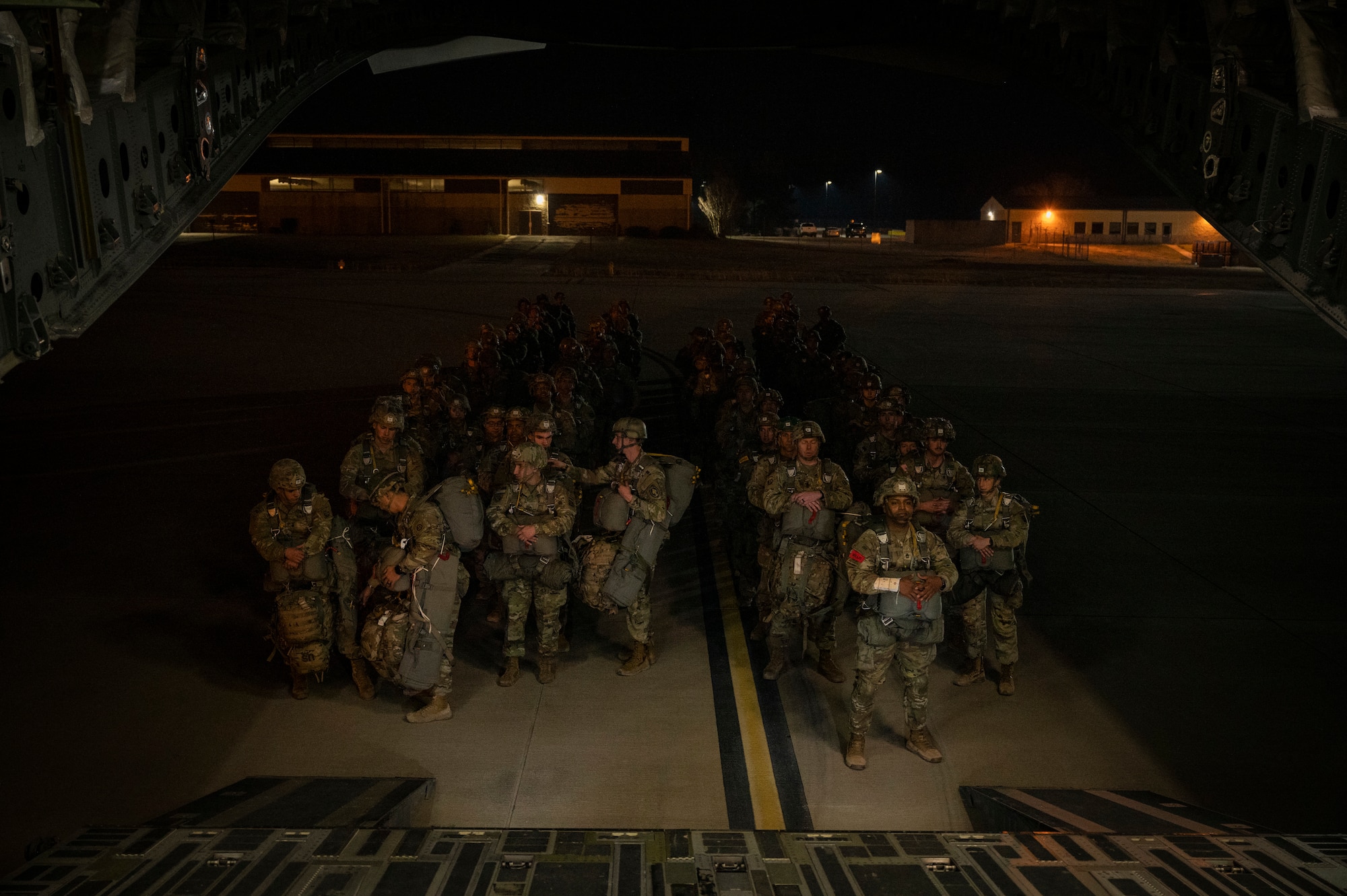 U.S. Army paratroopers assigned to the 82nd Airborne Division, Fort Bragg, North Carolina, board a C-17 Globemaster III during Battalion Mass Tactical Week, or BMTW, at Pope Army Airfield, North Carolina, Jan. 31, 2022. BMTW is a joint exercise between the U.S. Air Force and the U.S. Army, which gives participants the ability to practice contingency operations in a controlled environment. (U.S. Air Force photo by Airman 1st Class Charles Casner)