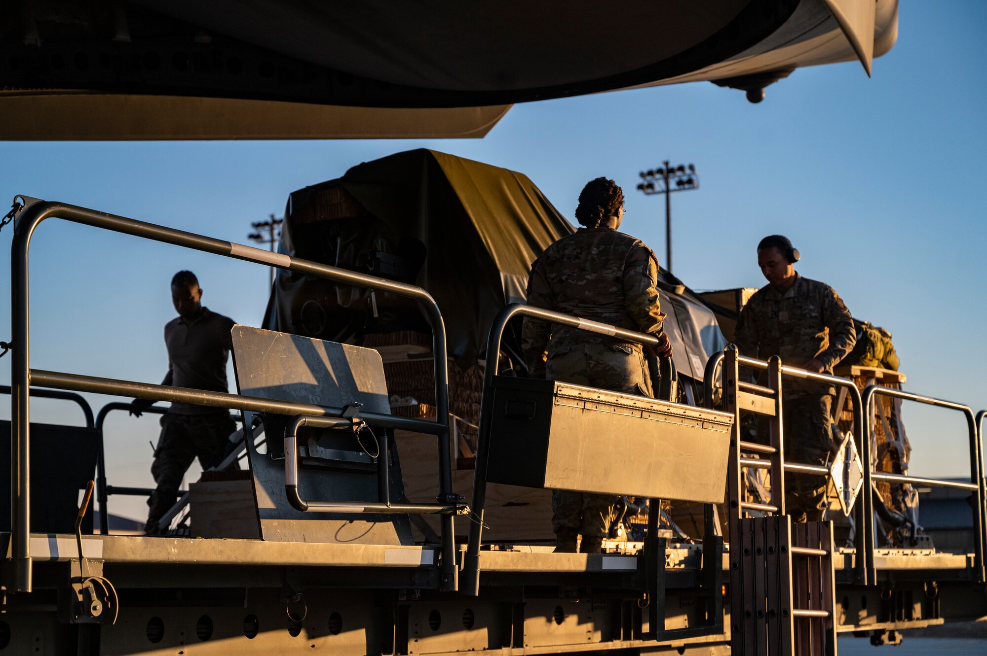 U.S. Airmen load cargo onto a C-17 Globemaster III assigned to Joint Base Lewis-McChord, Washington, during Battalion Mass Tactical Week at Pope Army Airfield, North Carolina, Feb. 1, 2022. BMTW is a joint exercise between the U.S. Air Force and the U.S. Army, which gives participants the ability to practice contingency operations in a controlled environment. (U.S. Air Force photo by Airman 1st Class Charles Casner)