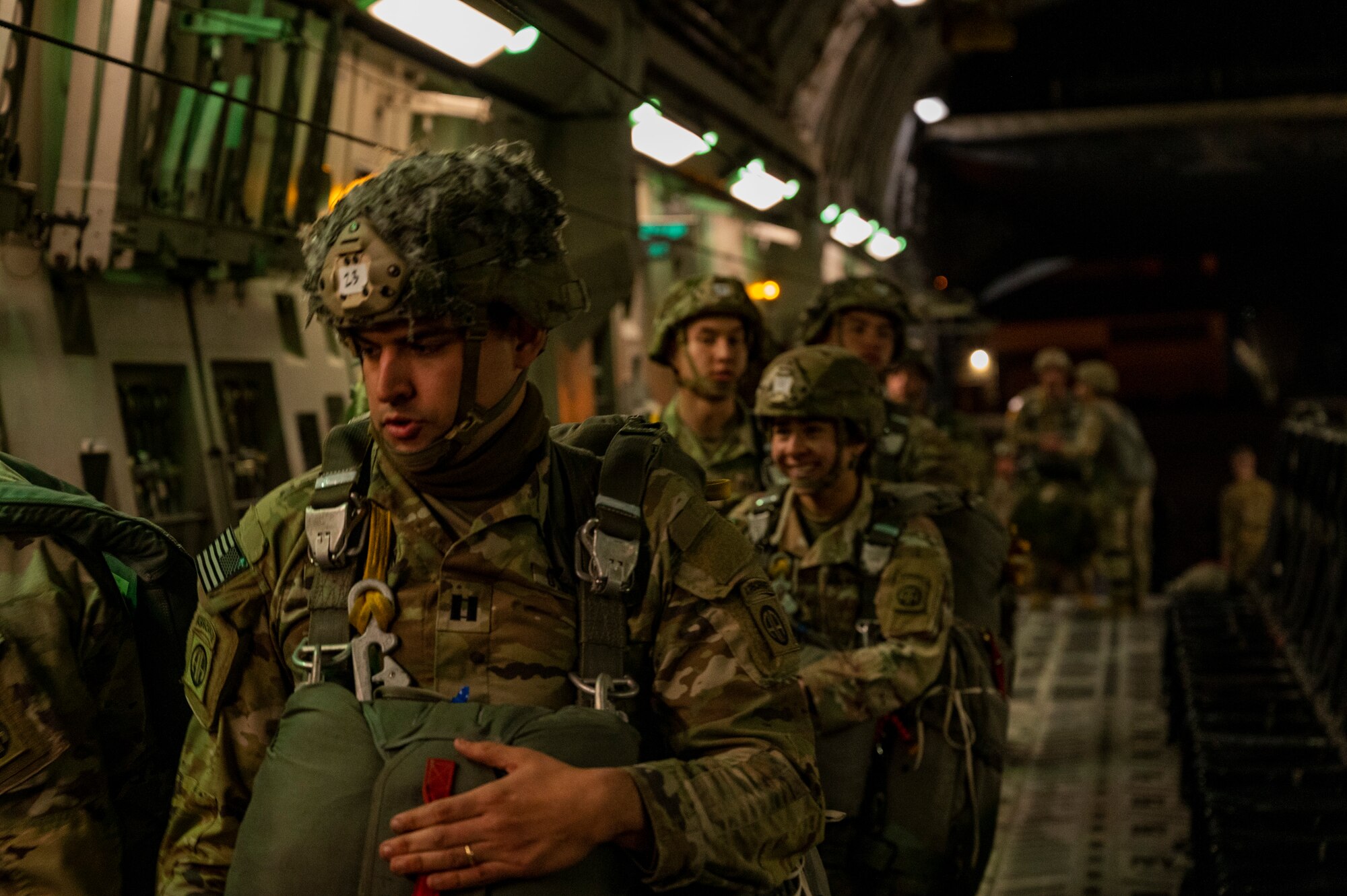 U.S. Army paratroopers assigned to the 82nd Airborne Division, Fort Bragg, North Carolina, board on a C-17 Globemaster III during Battalion Mass Tactical Week, or BMTW, at Pope Army Airfield, North Carolina, Jan. 31, 2022. BMTW is a joint exercise between the U.S. Air Force and the U.S. Army, which gives participants the ability to practice contingency operations in a controlled environment. (U.S. Air Force photo by Airman 1st Class Charles Casner)