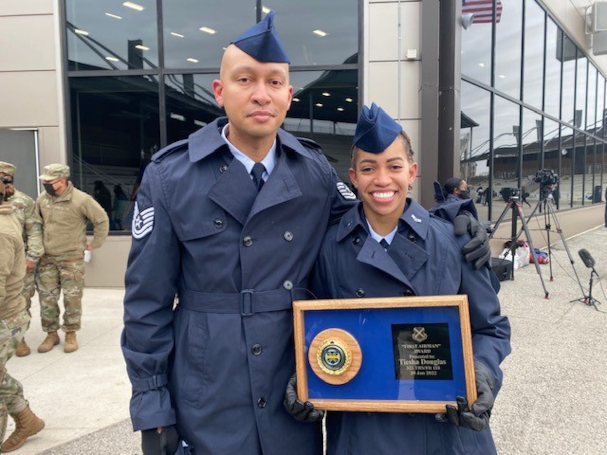 Airman siblings pose for a photo. He was her recruiter.