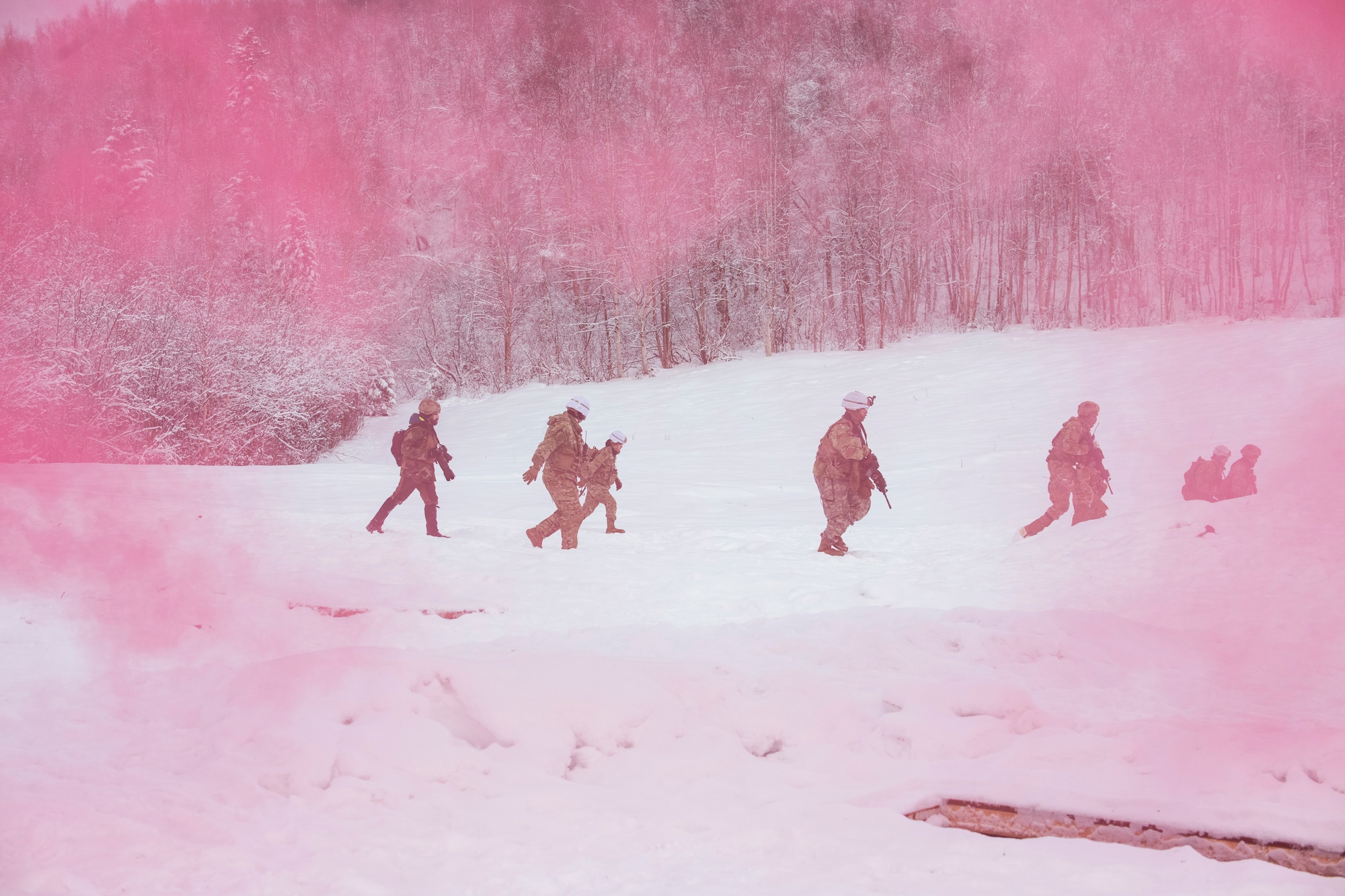 U.S. Army paratroopers assigned to A Troop, 1st Squadron (Airborne), 40th Cavalry Regiment, 4th Infantry Brigade Combat Team (Airborne), 25th Infantry Division, U.S. Army Alaska, assault a simulated enemy position on the Light Infantry Collective Training Course at Joint Base Elmendorf-Richardson, Alaska, Feb. 2, 2022. Cavalry scouts conducted live-fire maneuver training which focused on eliminating simulated enemy positions through fire team movement. USARAK trains year-round to increase lethal combat support in an arctic environment.