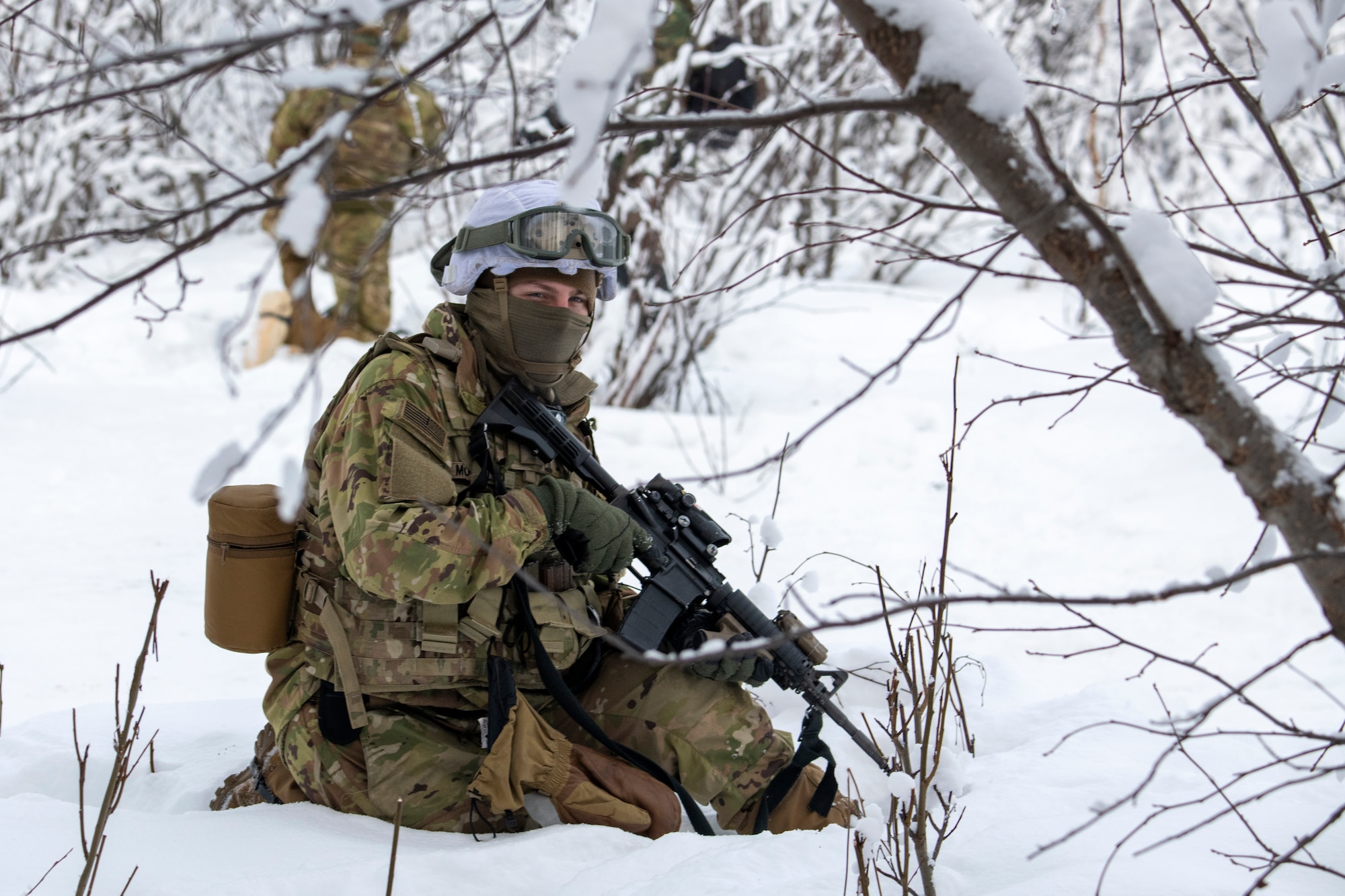 A U.S. Army paratrooper assigned to A Troop, 1st Squadron (Airborne), 40th Cavalry Regiment, 4th Infantry Brigade Combat Team (Airborne), 25th Infantry Division, U.S. Army Alaska, holds security on the Light Infantry Collective Training Course at Joint Base Elmendorf-Richardson, Alaska, Feb. 2, 2022. Cavalry scouts conducted live-fire maneuver training which focused on eliminating simulated enemy positions through fire team movement. USARAK trains year-round to increase lethal combat support in an arctic environment.