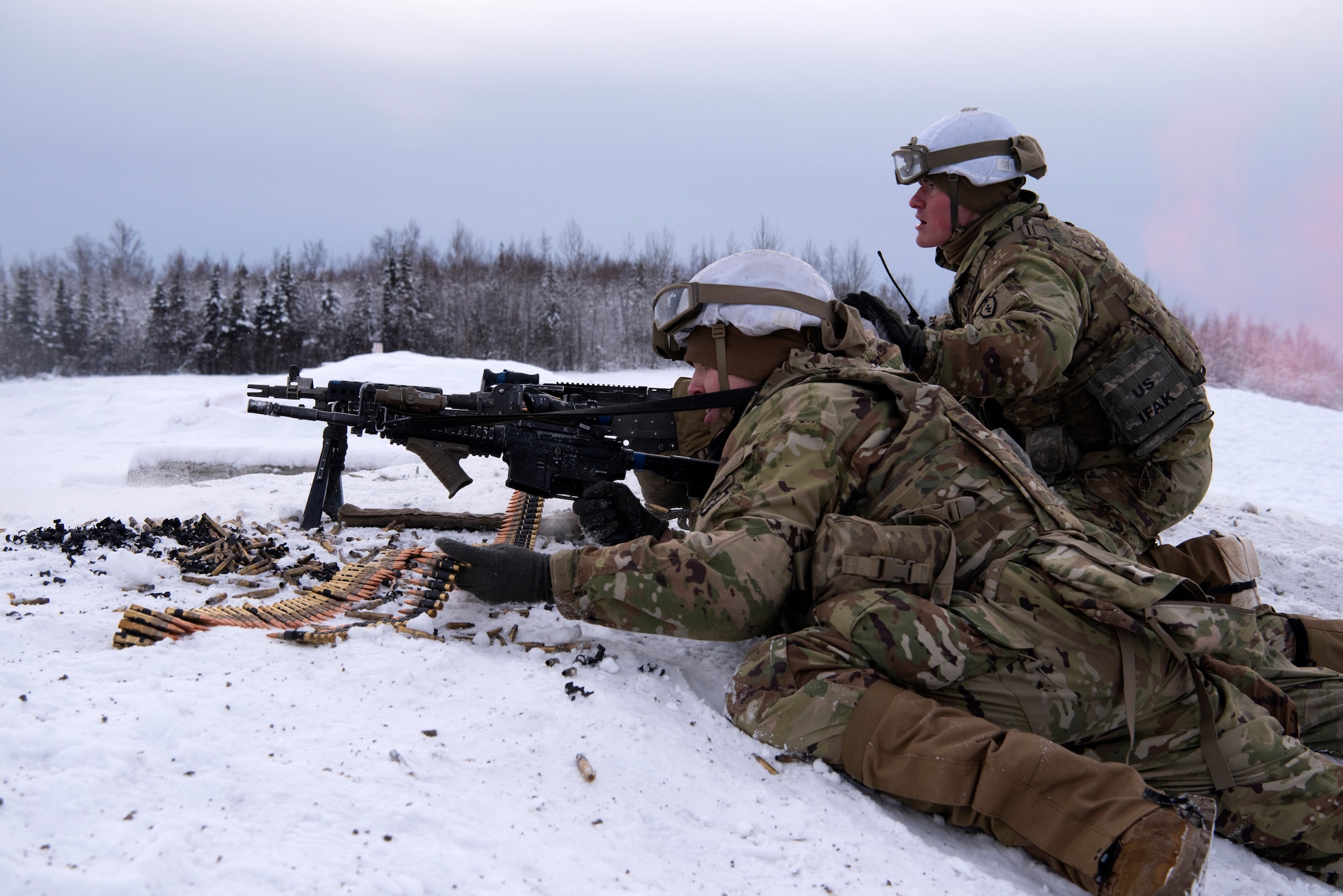 U.S. Army paratroopers assigned to A Troop, 1st Squadron (Airborne), 40th Cavalry Regiment, 4th Infantry Brigade Combat Team (Airborne), 25th Infantry Division, U.S. Army Alaska, engage a simulated enemy position on the Light Infantry Collective Training Course at Joint Base Elmendorf-Richardson, Alaska, Feb. 2, 2022. Cavalry scouts conducted live-fire maneuver training which focused on eliminating simulated enemy positions through fire team movement. USARAK trains year-round to increase lethal combat support in an arctic environment.