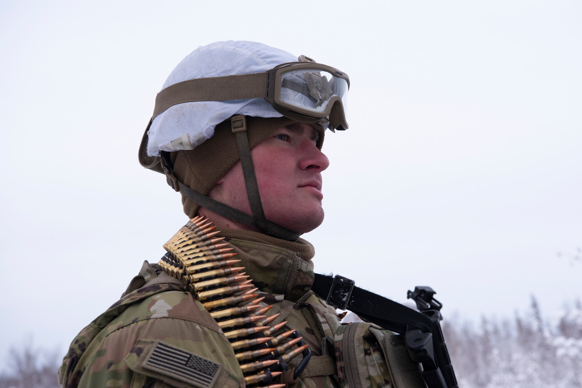 U.S. Army Sgt. Smith Beacham, a cavalry scout assigned to A Troop, 1st Squadron (Airborne), 40th Cavalry Regiment, 4th Infantry Brigade Combat Team (Airborne), 25th Infantry Division, U.S. Army Alaska, listens to an after-action brief on the Light Infantry Collective Training Course at Joint Base Elmendorf-Richardson, Alaska, Feb. 2, 2022. Cavalry scouts conducted live-fire maneuver training which focused on eliminating simulated enemy positions through fire team movement. USARAK trains year-round to increase lethal combat support in an arctic environment.