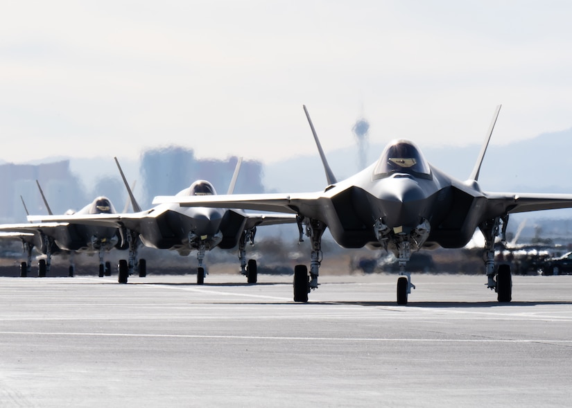 a photo of F-35As taxiing down the runway.