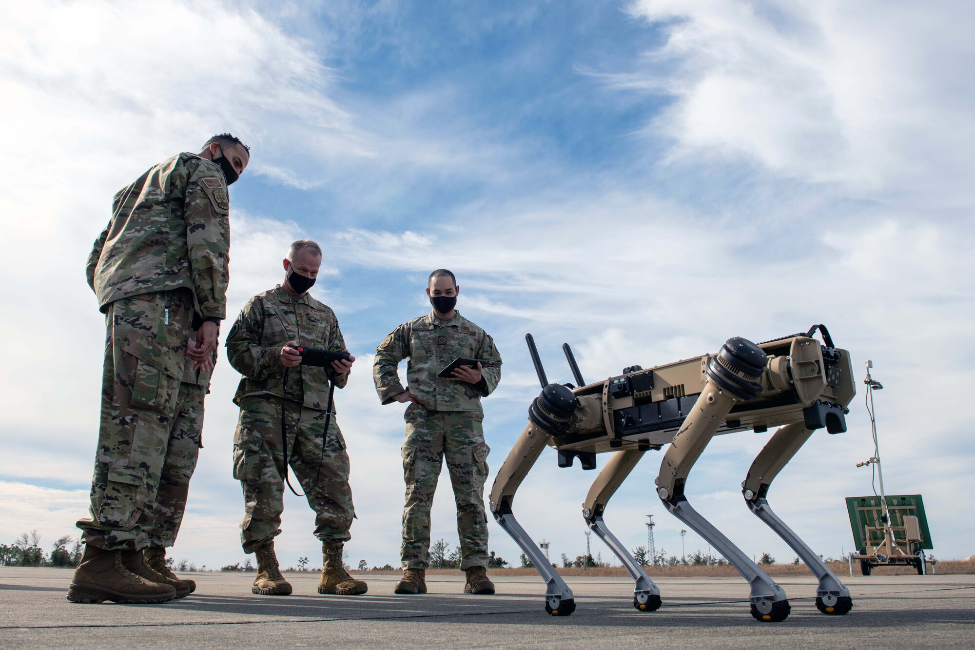 U.S. Air Force Gen. Mark D. Kelly, commander of Air Combat Command, operates a Quad-legged Unmanned Ground Vehicle