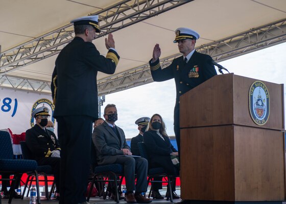 Cmdr. Kevin Ray accepts command of the Independence-variant littoral combat ship USS Savannah (LCS 28) during a commissioning ceremony.