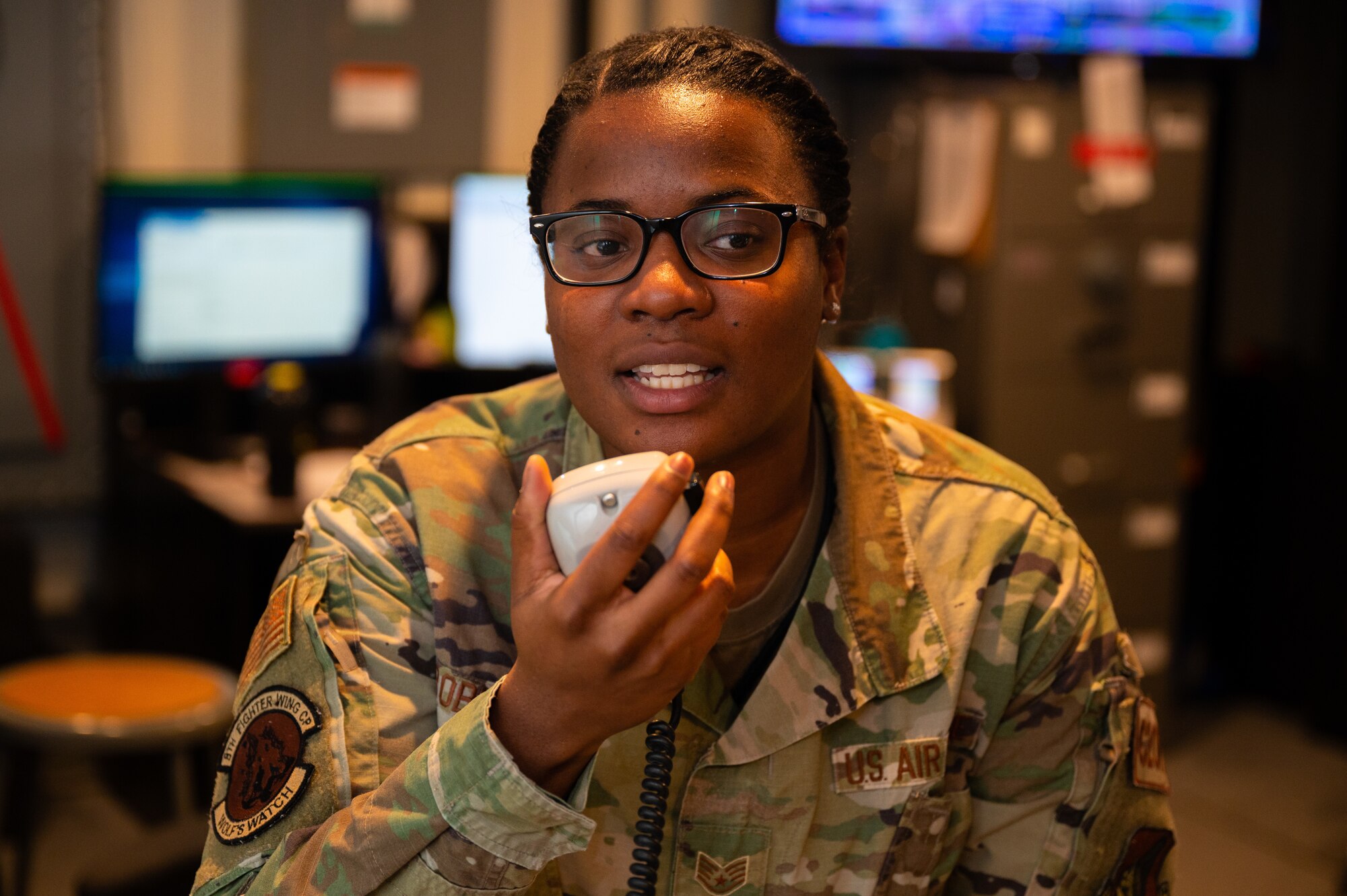 Staff Sgt. Carlneesha Robinson, 8th Command Post Senior Emergency Actions Officer, operates the 'giant voice' notification system on Kunsan Air Base, Republic of Korea, Jan. 24, 2022. As the eyes, ears and voice of the Wolf Pack, the command post section keeps Kunsan AB ready to fight tonight.