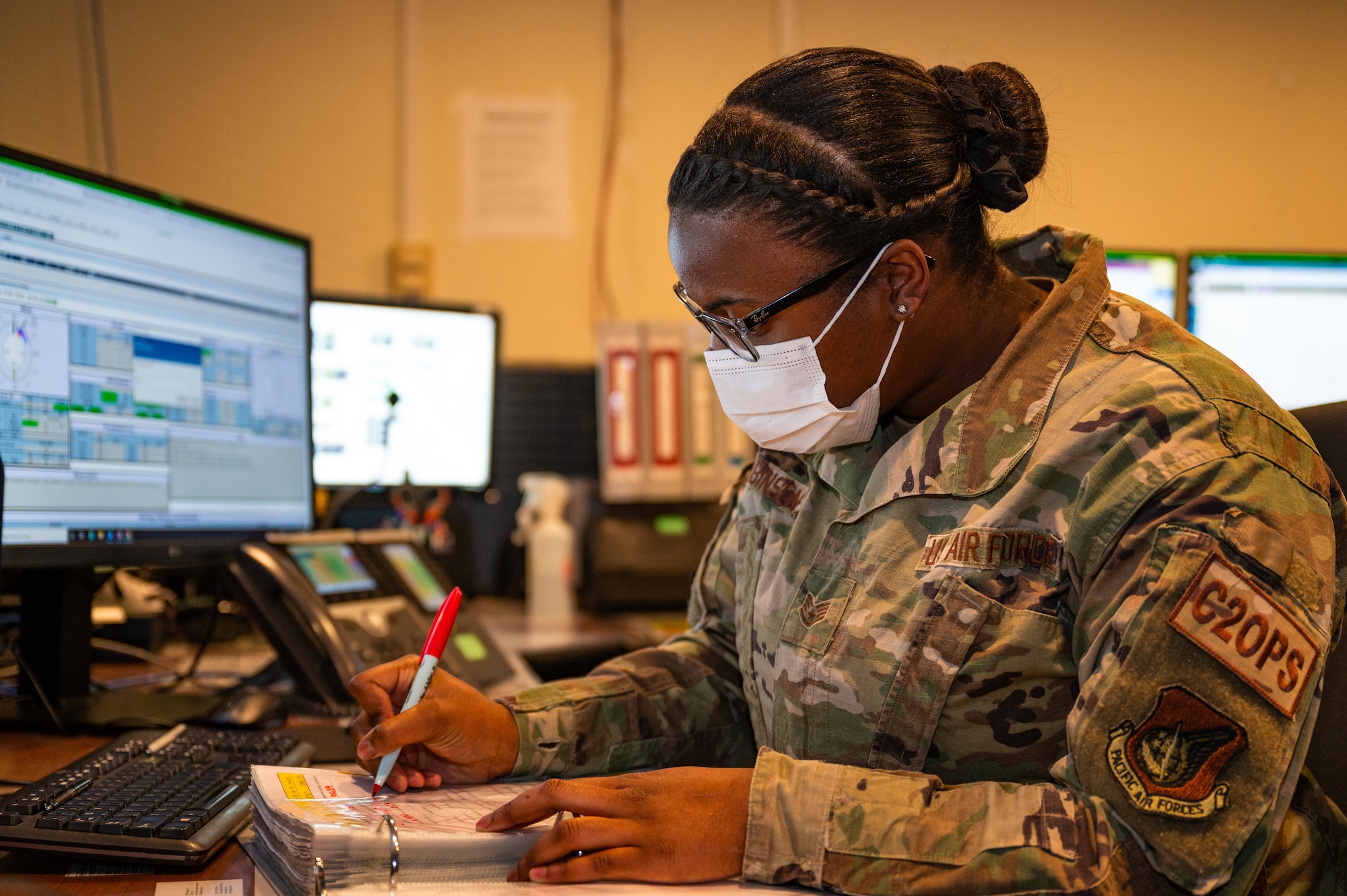 Staff Sgt. Carlneesha Robinson, 8th Command Post Senior Emergency Actions Officer, runs down a command post checklist on Kunsan Air Base, Republic of Korea, Jan. 24, 2022. As the eyes, ears and voice of the Wolf Pack, the command post section keeps Kunsan AB ready to fight tonight.