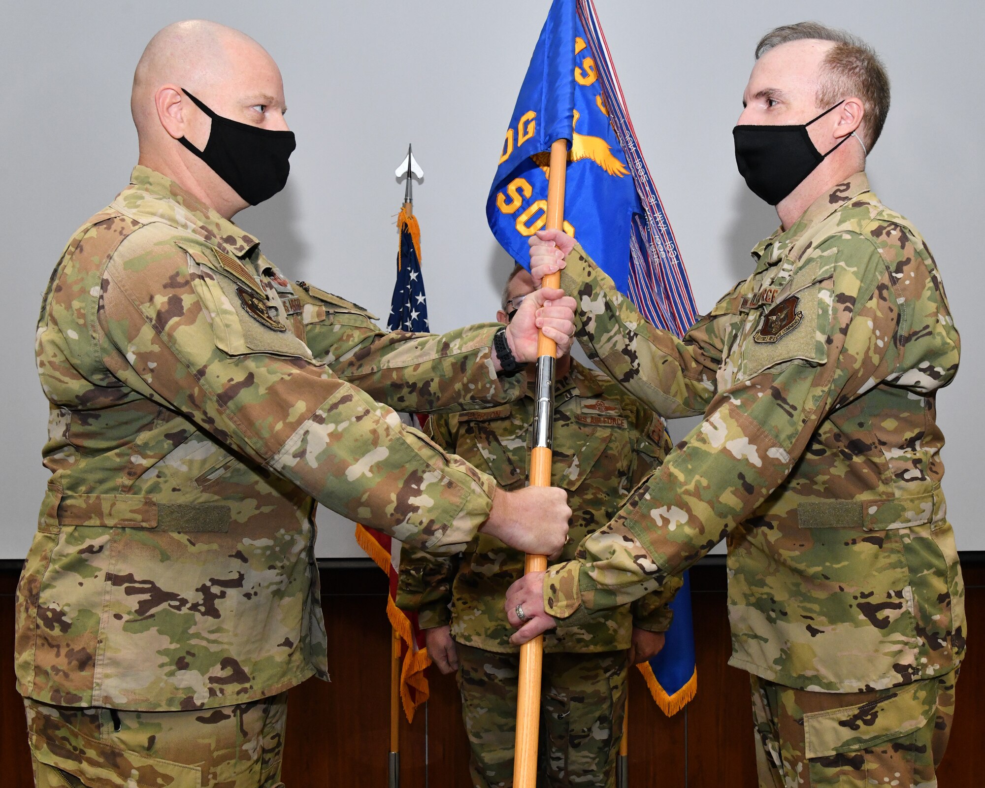 Col. Grandy passes the 919th SOG's unit flag to Col. Barry