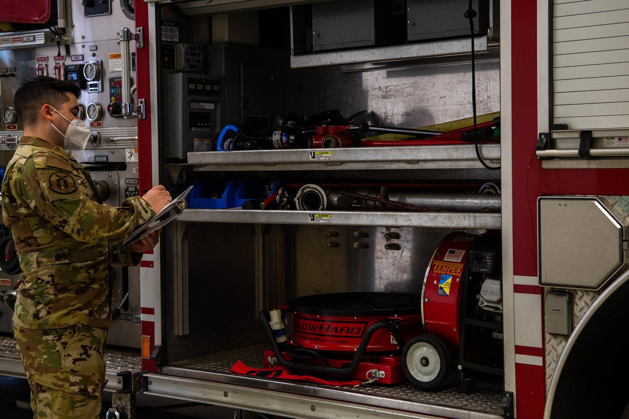 Airmen ensures fire truck is ready.