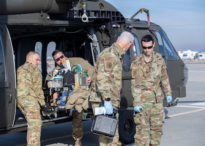 Members from the 124th Medical Group’s Critical Care Air Transport Team participate in a medical evacuation exercise during their unit training assembly Feb. 5, 2022, at Gowen Field Air National Guard Base, Idaho. The exercise tested the CCATT’s ability to respond to a request, treat and stabilize the mock patient, and then transport the patient to a Black Hawk in a real-world situation.