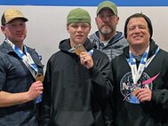 Soldiers from the Fort Carson Soldier Recovery Unit (SRU) in Colorado celebrate their medals after the Ski Spectacular event in Breckenridge, Colorado in December 2021. From left to right: Spc. Dillon Edwards, Spc. Kyle Bradley, Paul Lettbrown, Staff Sgt. Derrek Smith.