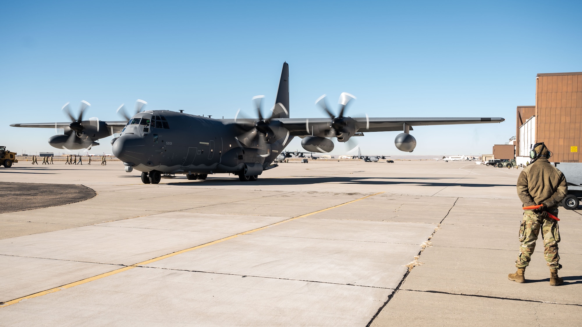 An MC-130J Commando II is prepared for flight.