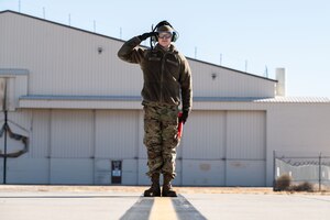 An Airman salutes.