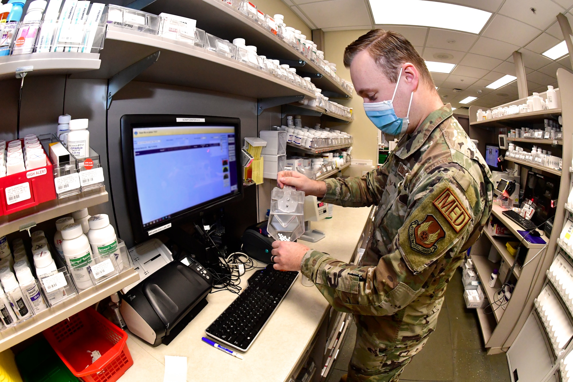 Senior Airman Jimmy Barnes, 75th Medical Group, pharmacy technician, fills prescriptions for customers at the satellite pharmacy Feb. 4, at Hill Air Force Base, Utah.  Starting Feb. 14, customers will have to pick up refilled prescriptions at the Main Pharmacy or at the self-serve prescription kiosk, which is located next to the Satellite Pharmacy.  (U.S. Air Force photo by Todd Cromar)