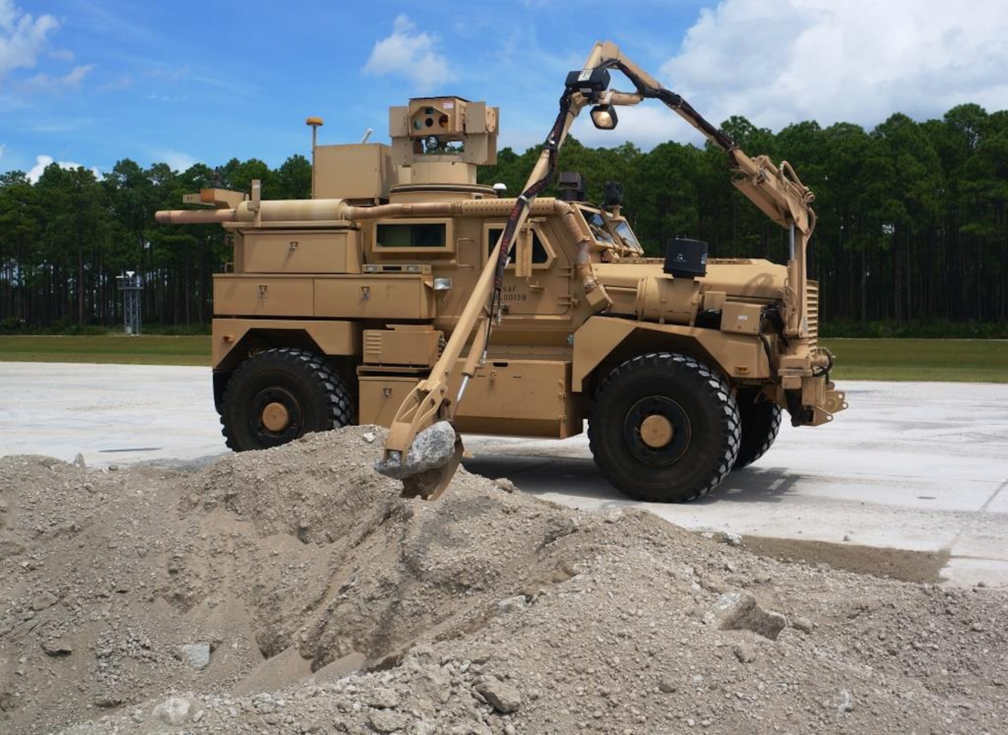 A Recovery of Airbase Denied By Ordnance (RADBO) vehicle, uses a robotic arm to investigate craters or areas where an unexploded device may be located. (Courtesy photo)