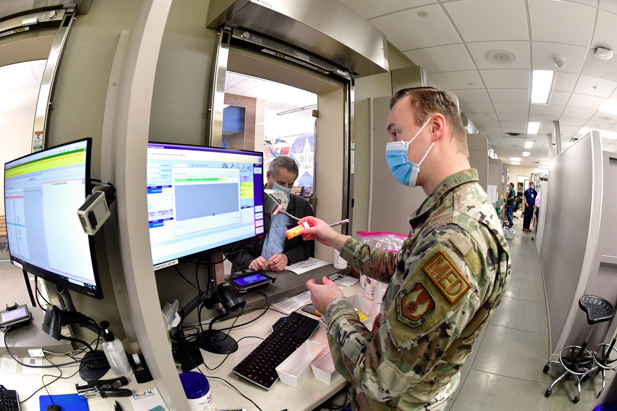 Senior Airman Jimmy Barnes, 75th Medical Group, pharmacy technician, fills prescriptions for customers at the satellite pharmacy Feb. 4, at Hill Air Force Base, Utah.  Starting Feb. 14, customers will have to pick up refilled prescriptions at the Main Pharmacy or at the self-serve prescription kiosk, which is located next to the Satellite Pharmacy.  (U.S. Air Force photo by Todd Cromar)